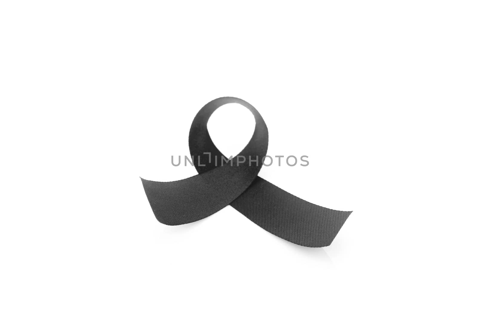 Black ribbon symbol for mourning on white background by pt.pongsak@gmail.com