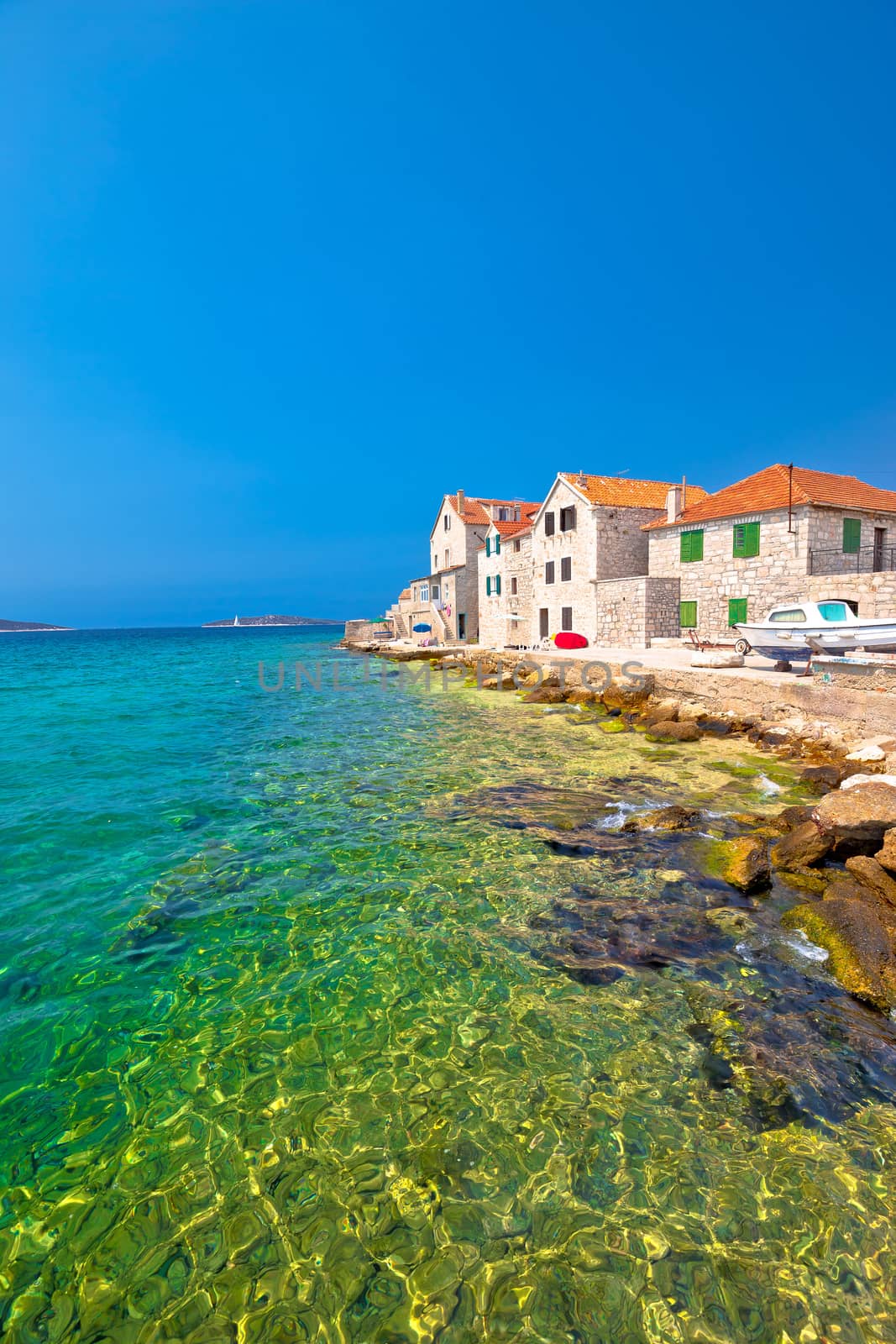 Turquoise beach and stone waterfront in Prvic Sepurine, Sibenik archipelago of Dalmatia, Croatia