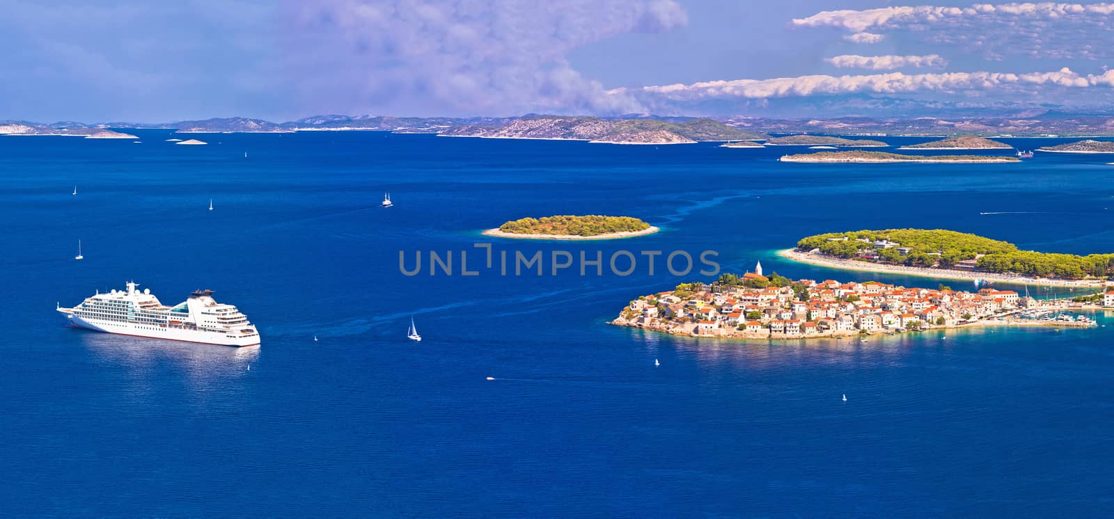 Adriatic tourist destination of Primosten aerial panoramic archipelago view, with cruiser ship, Dalmatia, Croatia