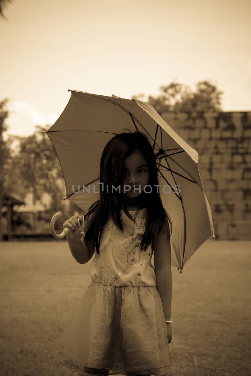Cute girl standing in fashion photo in the sun by N_u_T