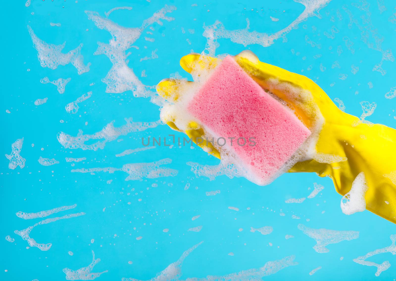 Cleaning conept, hand cleaning glass window pane with detergent and wipe or sponge