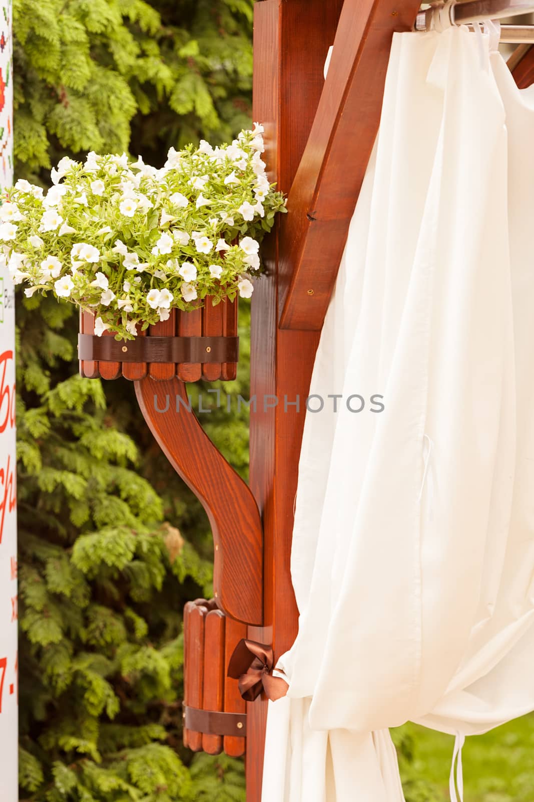 Hanging wooden flower arrangement at the entrance, note shallow depth of field
