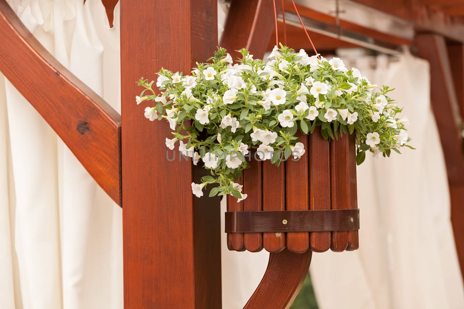 Hanging wooden flower arrangement at the entrance, note shallow depth of field