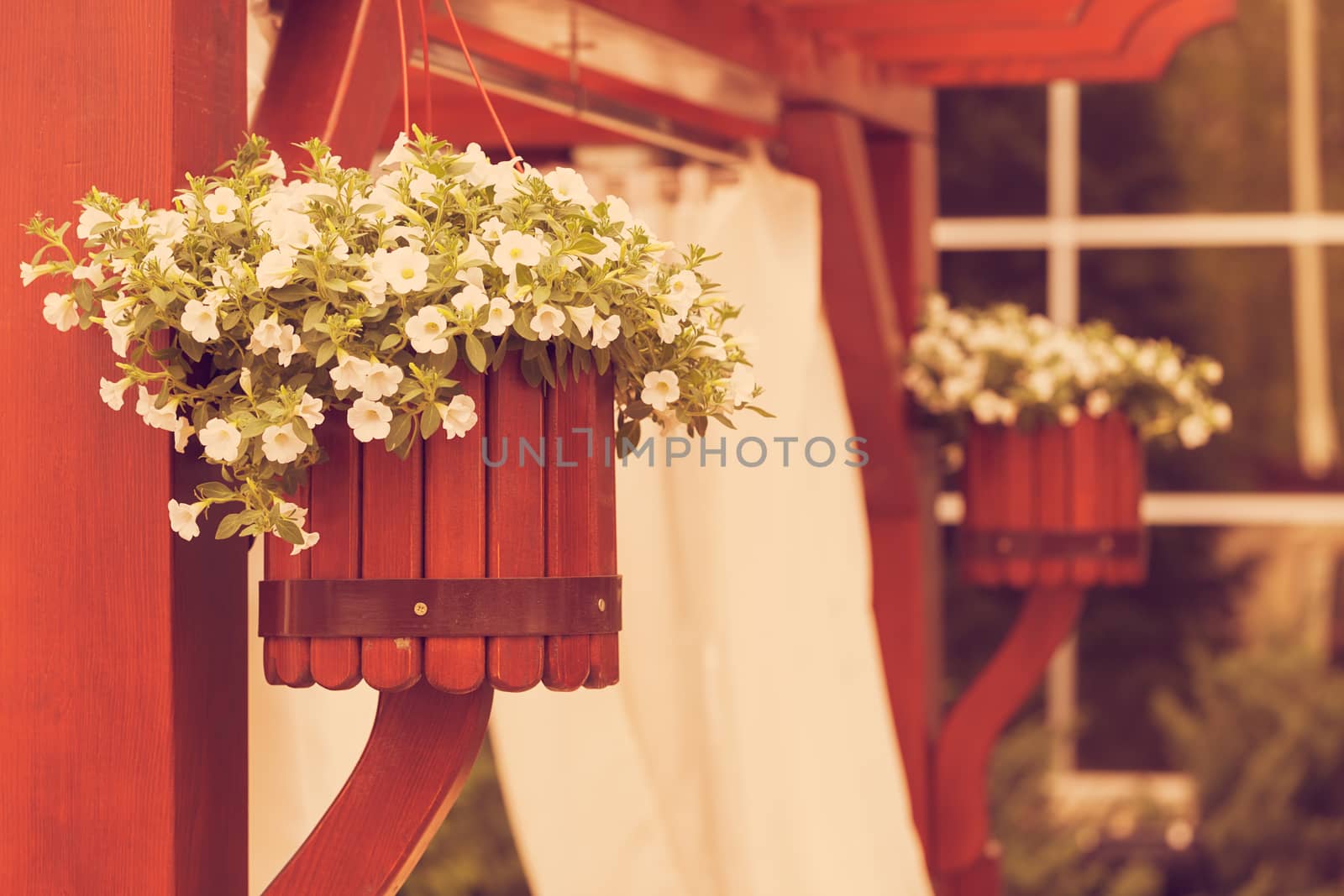 Hanging wooden flower arrangement at the entrance, note shallow depth of field