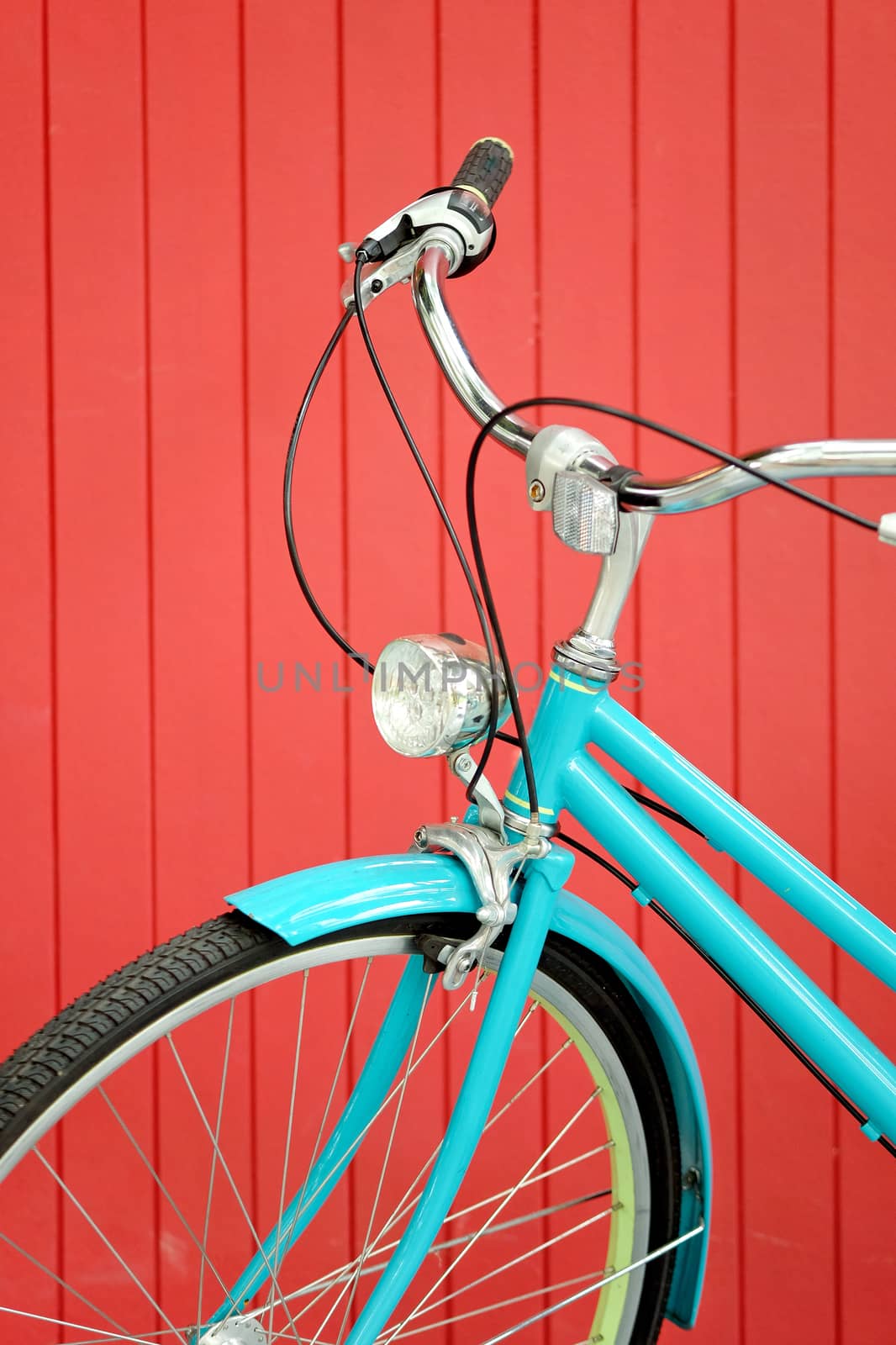 retro bicycle in front of the red wall background