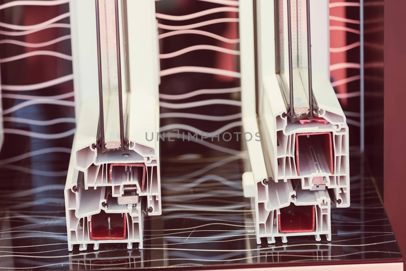 cross-section aluminum window frames on a colorful background , note shallow depth of field