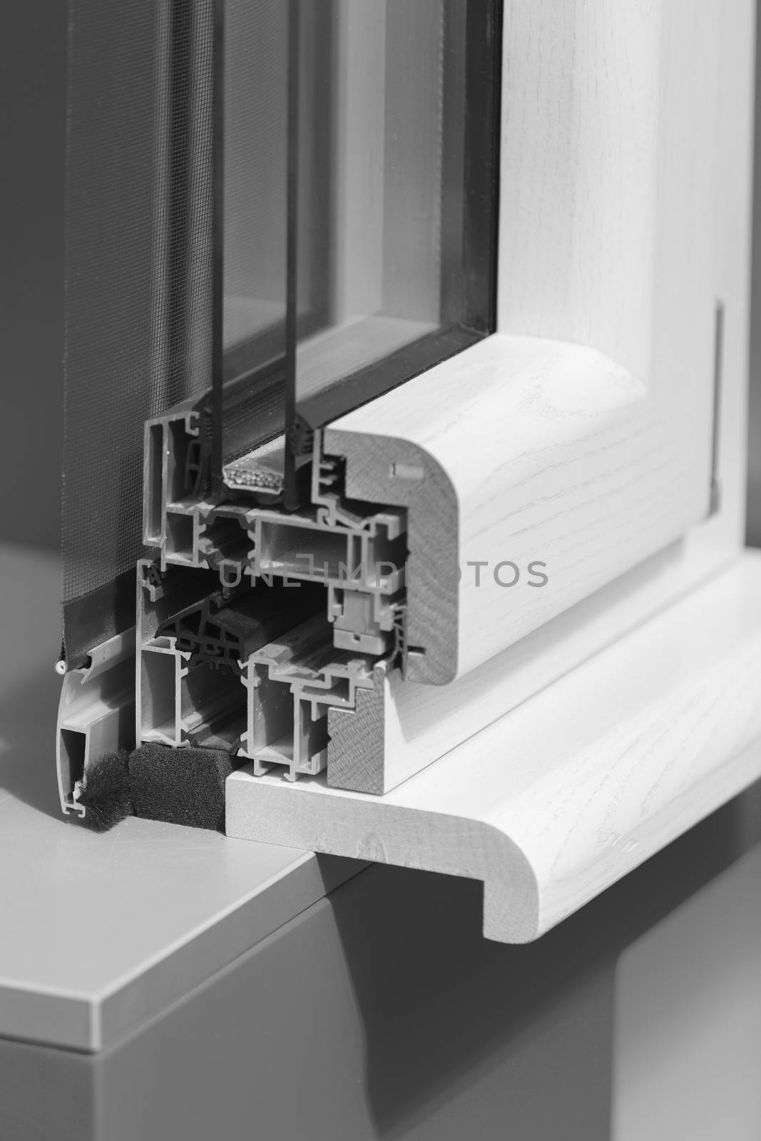 lateral cross-section aluminum frame windows with  mehanism for shutters, note shallow depth of field