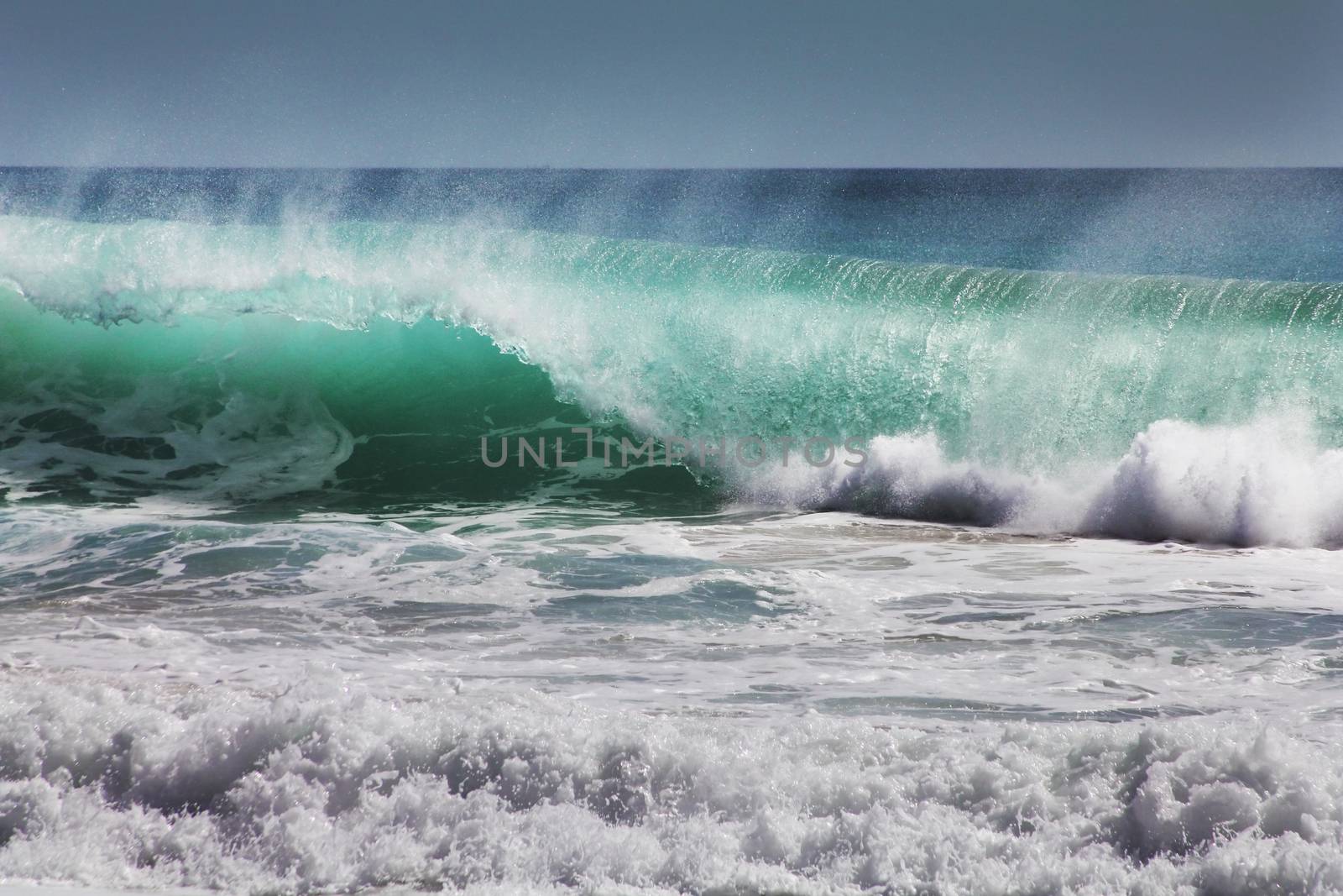 Big wave crashes on to the shore. Indian ocean