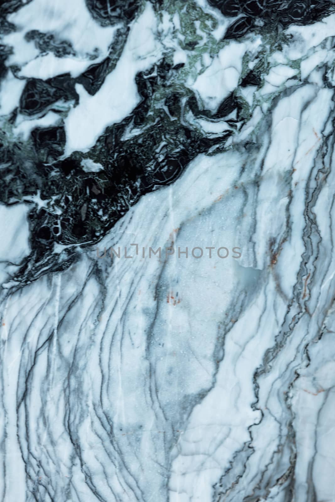 Abstraction stone wall with blue reflection, note shallow depth of field