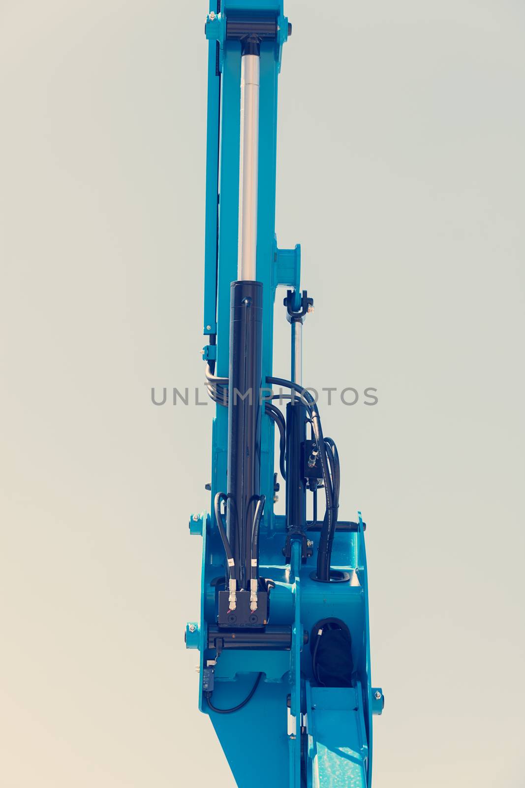 Details crane in construction on the blue background, note shallow depth of field