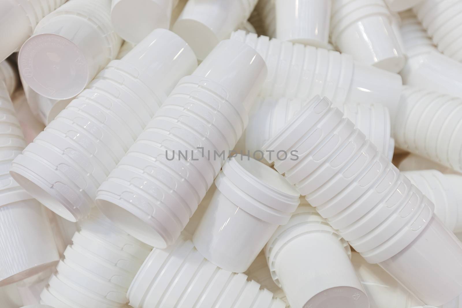 products from machinery for the production of plastic cups, note shallow depth of field