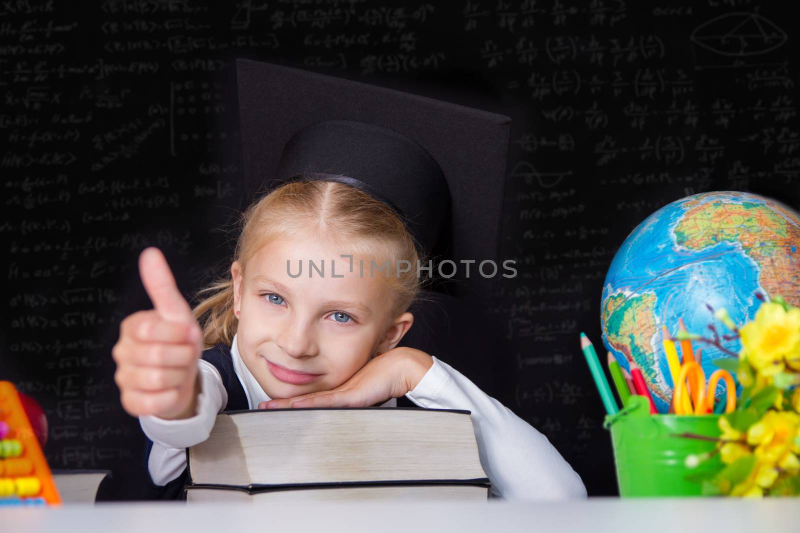 Gilr in graduation cap showing ok sign by Angel_a