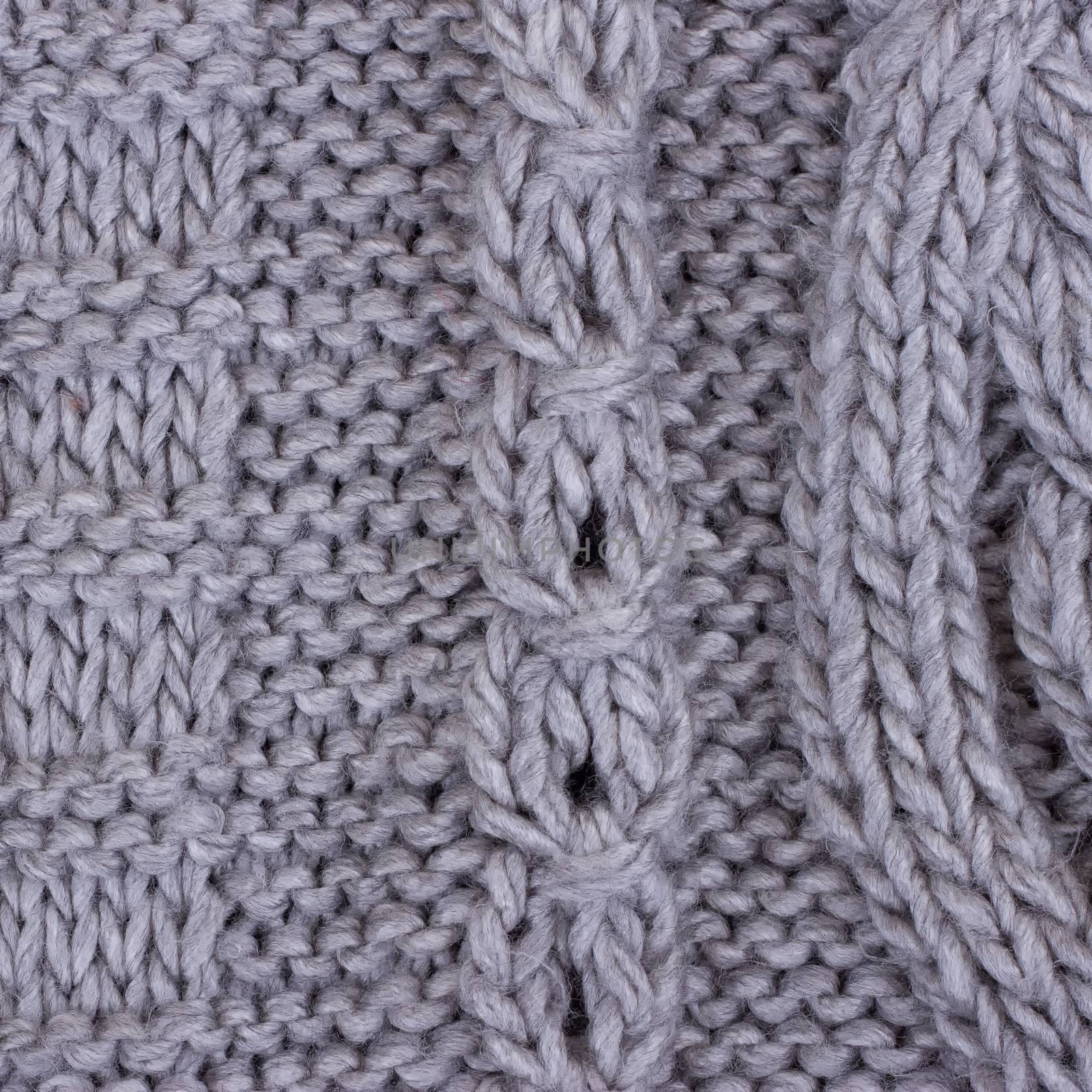 Gray knitting background texture. Knit woolen Fabric textile