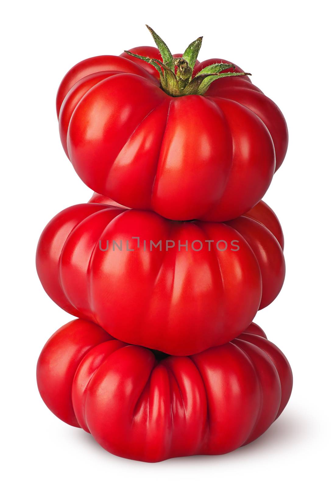 Stack of fresh heirloom tomatoes isolated on white background