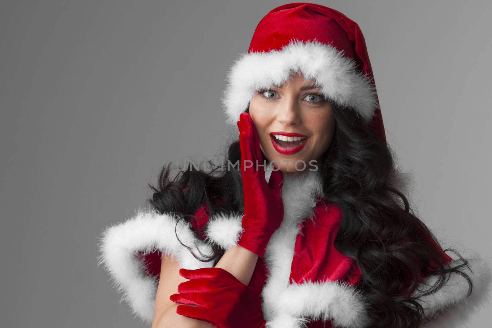 Portrait of beautiful sexy girl wearing santa claus clothes