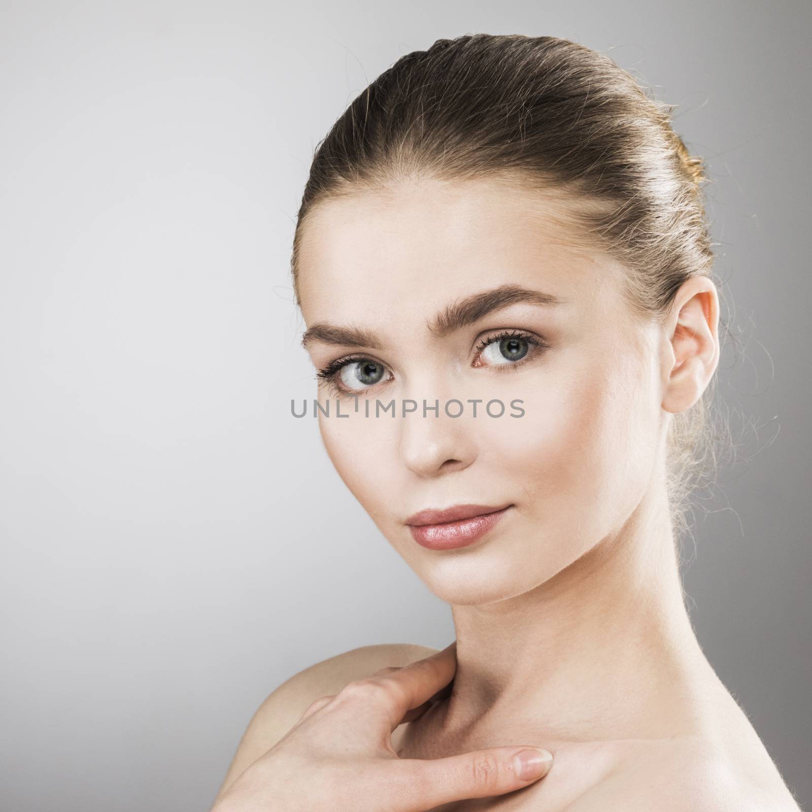 Beauty woman face portrait. Beautiful spa model girl with perfect fresh clean skin. Female looking at camera. Youth and skin care Concept