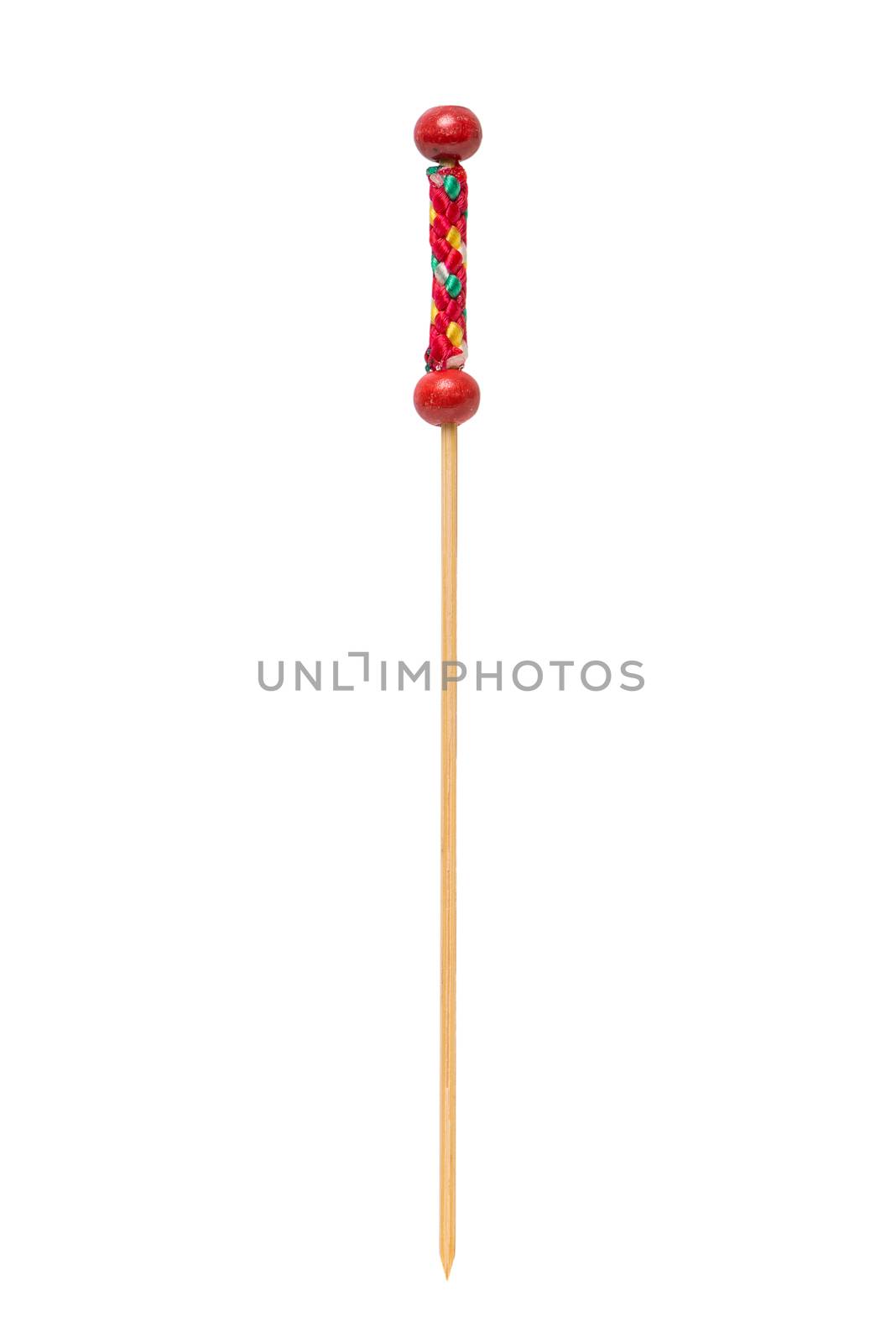 Wooden decorative toothpick closeup isolated on white background.