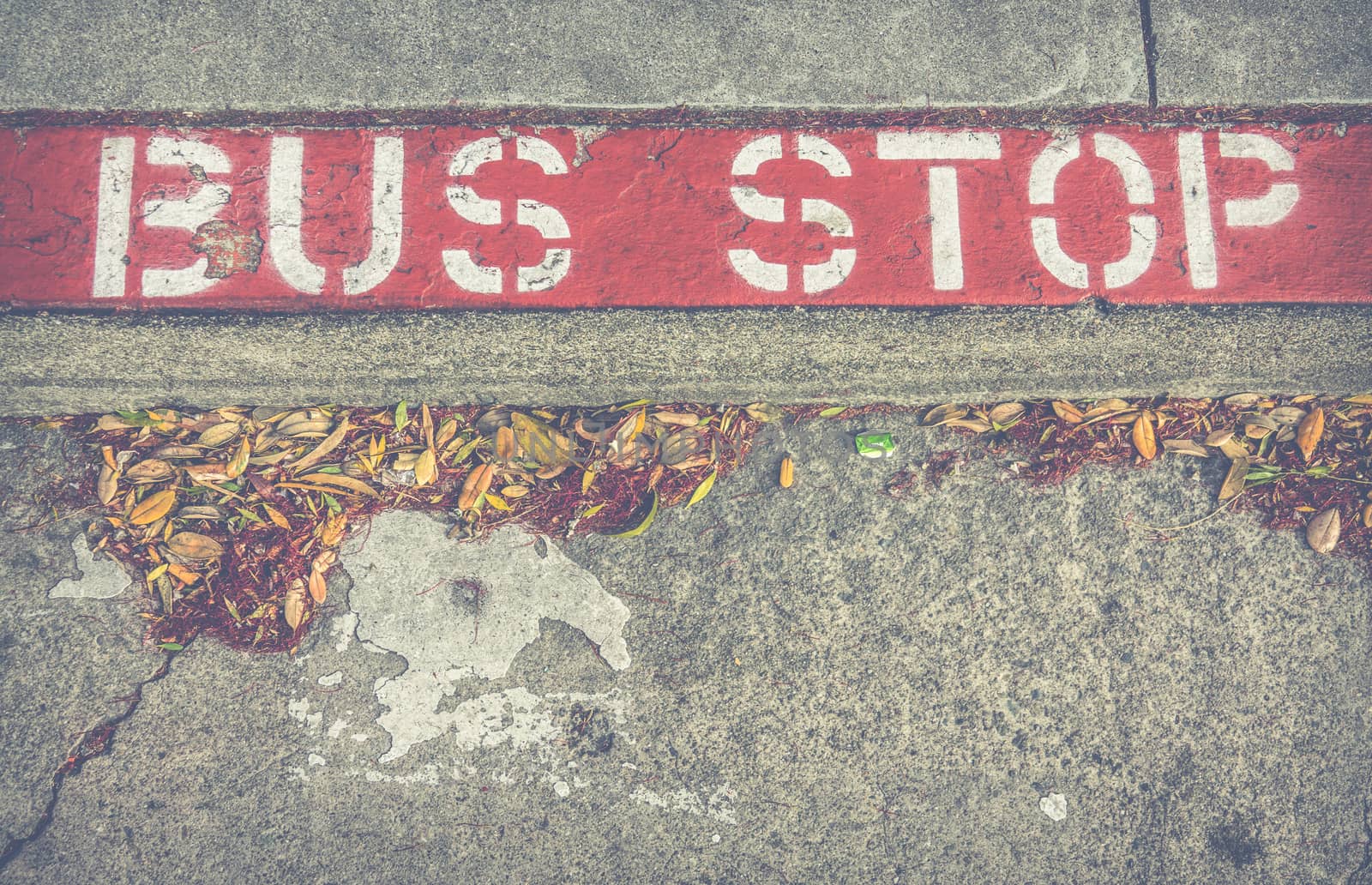 Old Bus Stop Sign On A Sidewalk In San Francisco