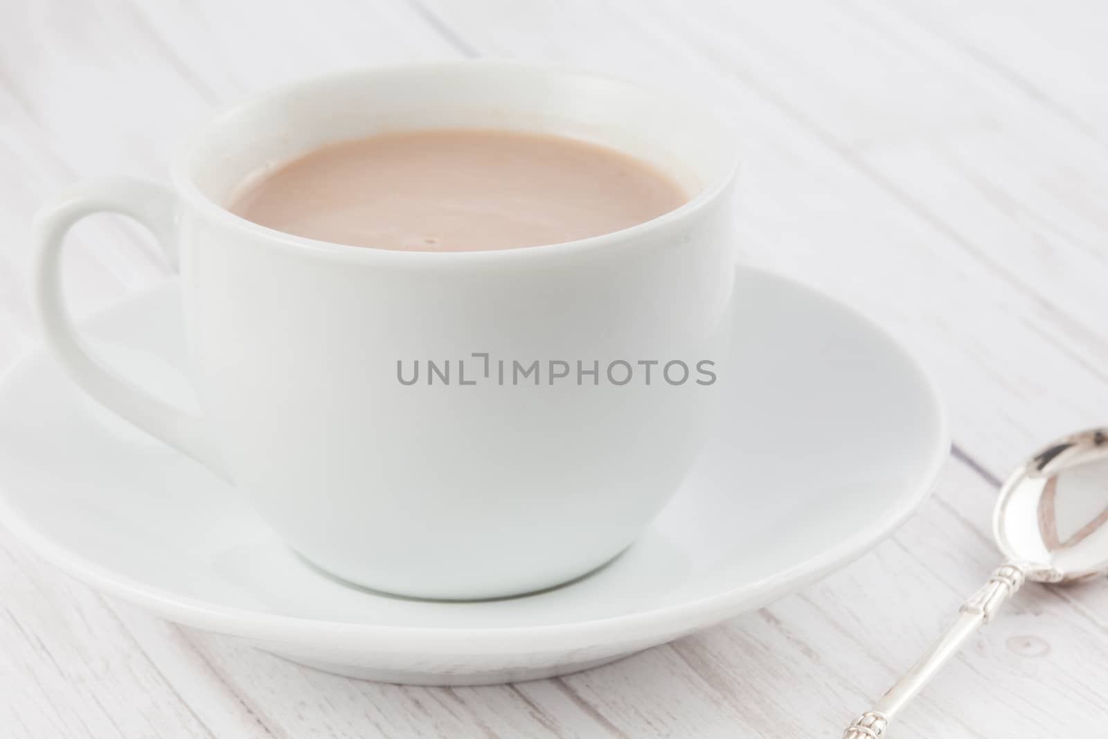 Cup of hot chocolate served in white dishware