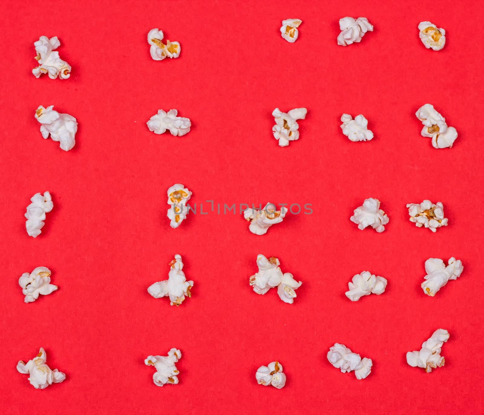 popcorn neatly laid out on a red background