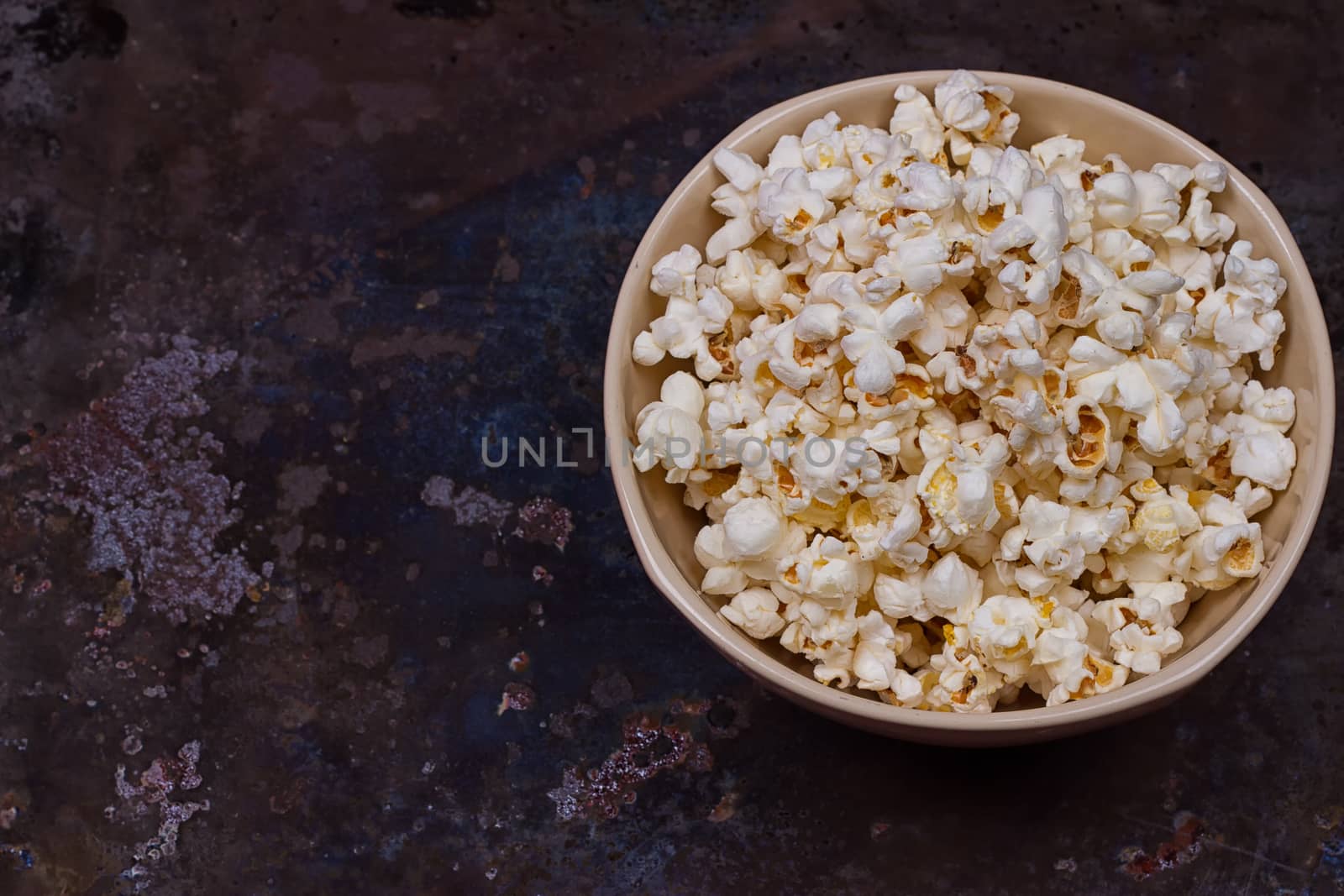 Popcorn in a bowl on a grunge background