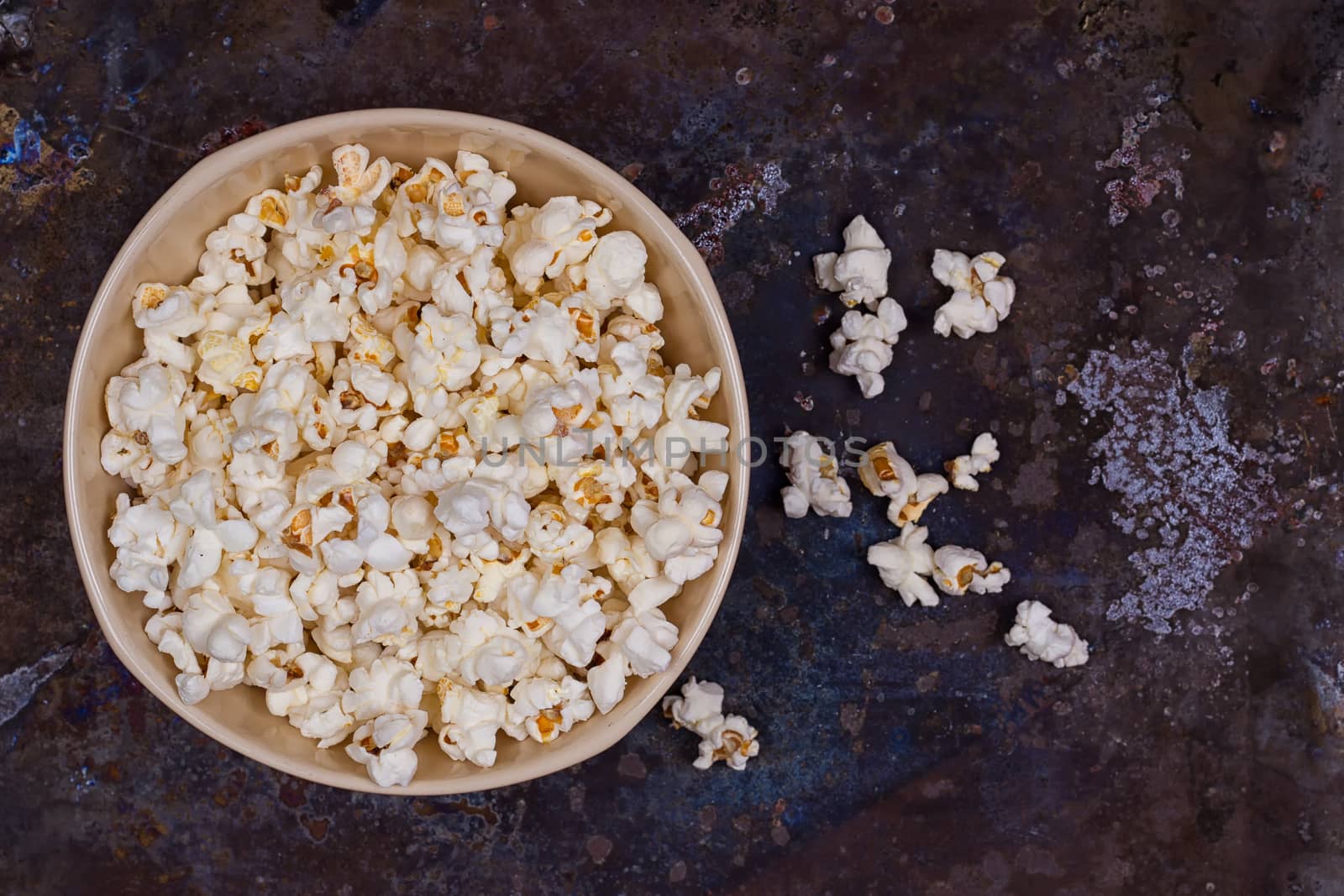 Popcorn in a bowl on a grunge background