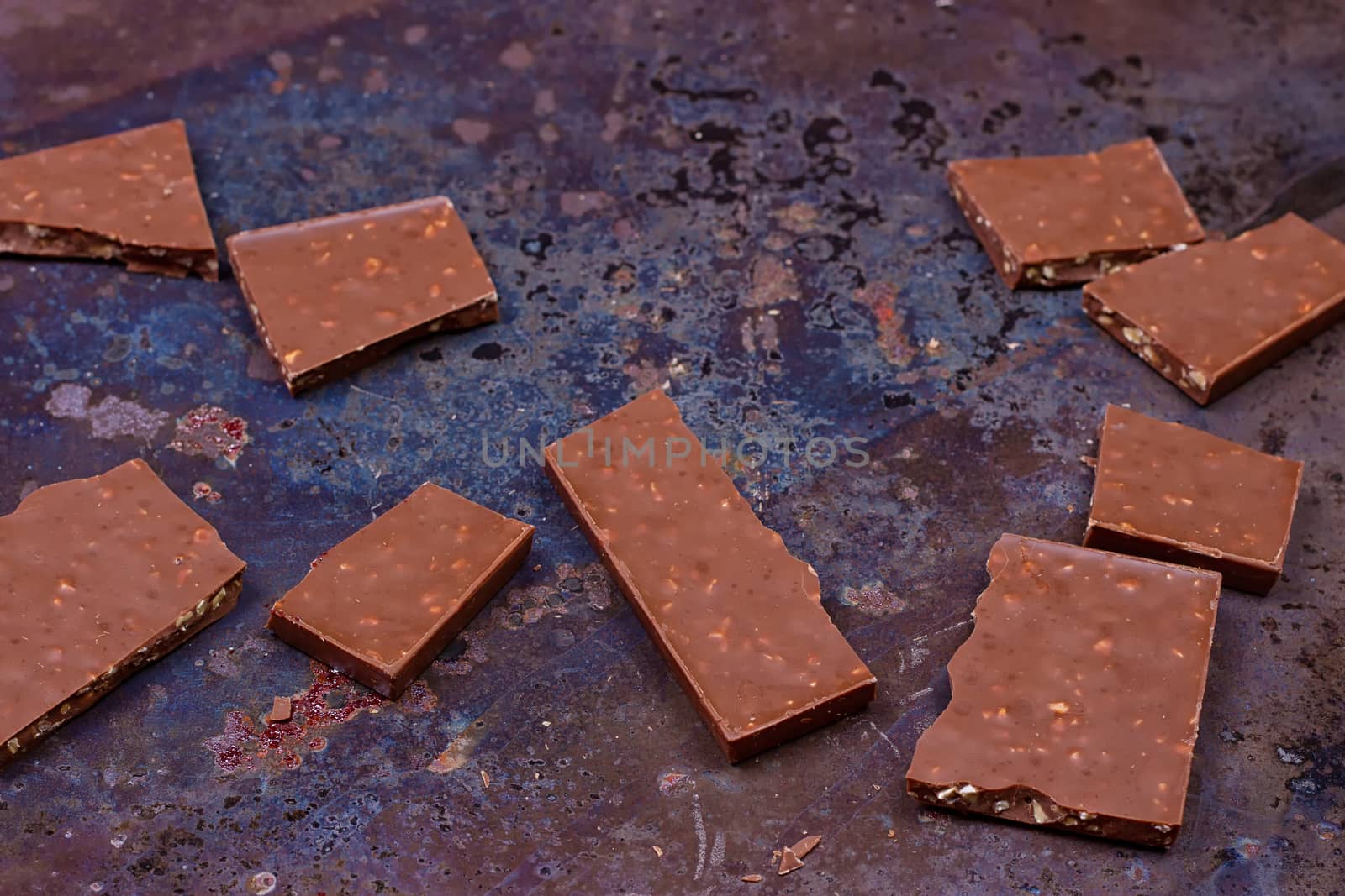 Milk chocolate bar on a black grunge background