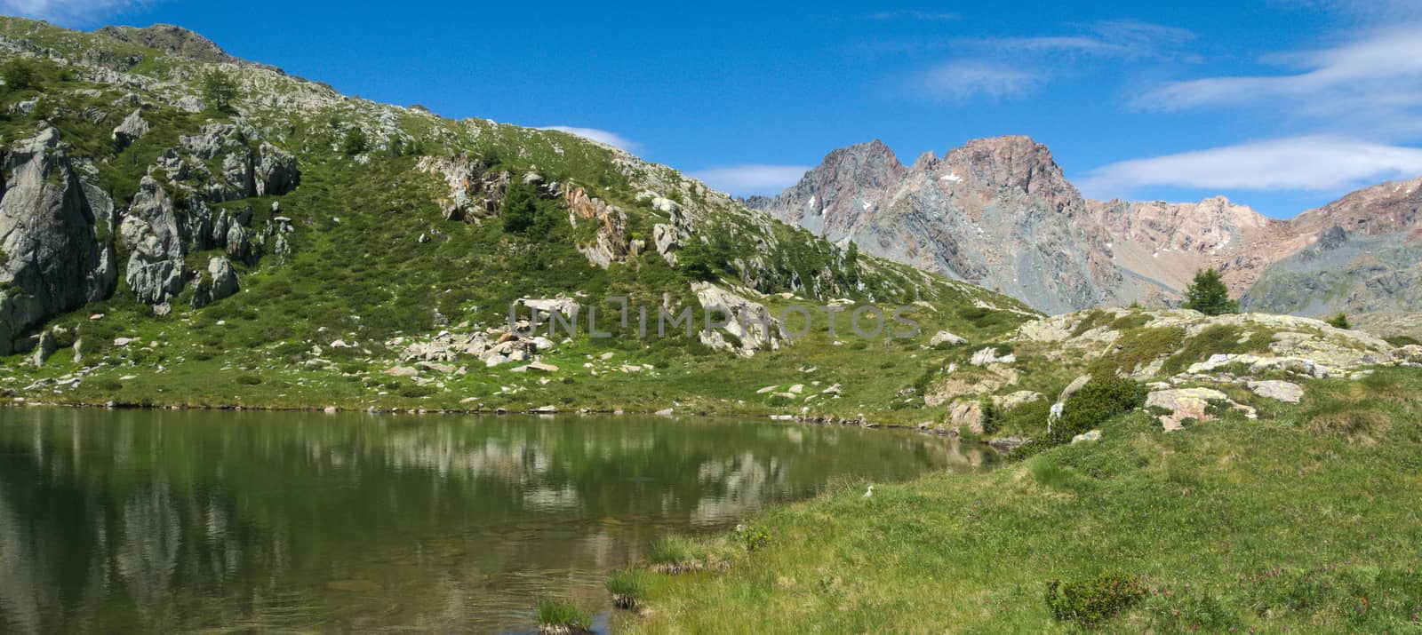Small lake on the Italian alps in Valmalenco
