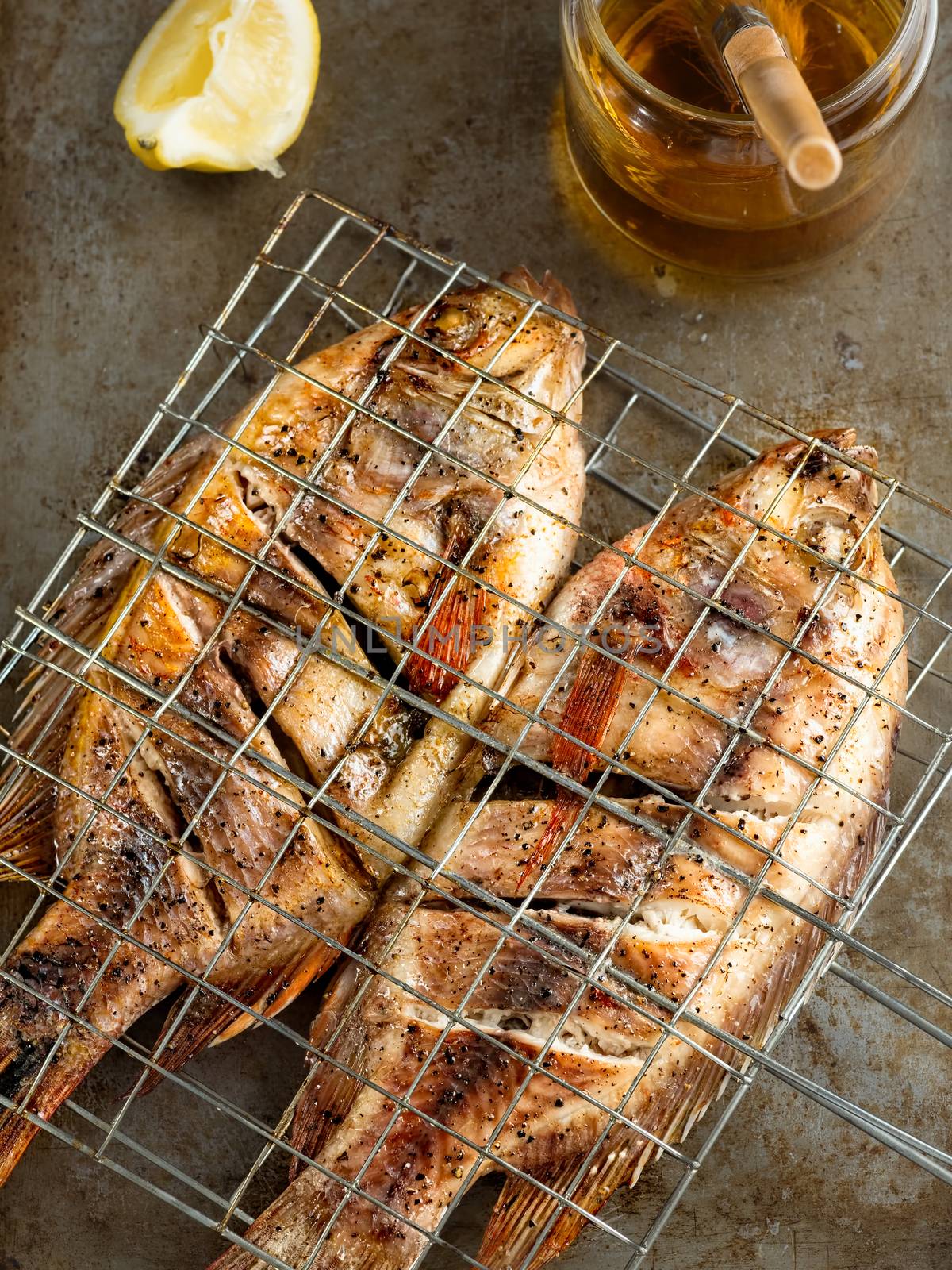 close up of rustic barbecued grilled fish