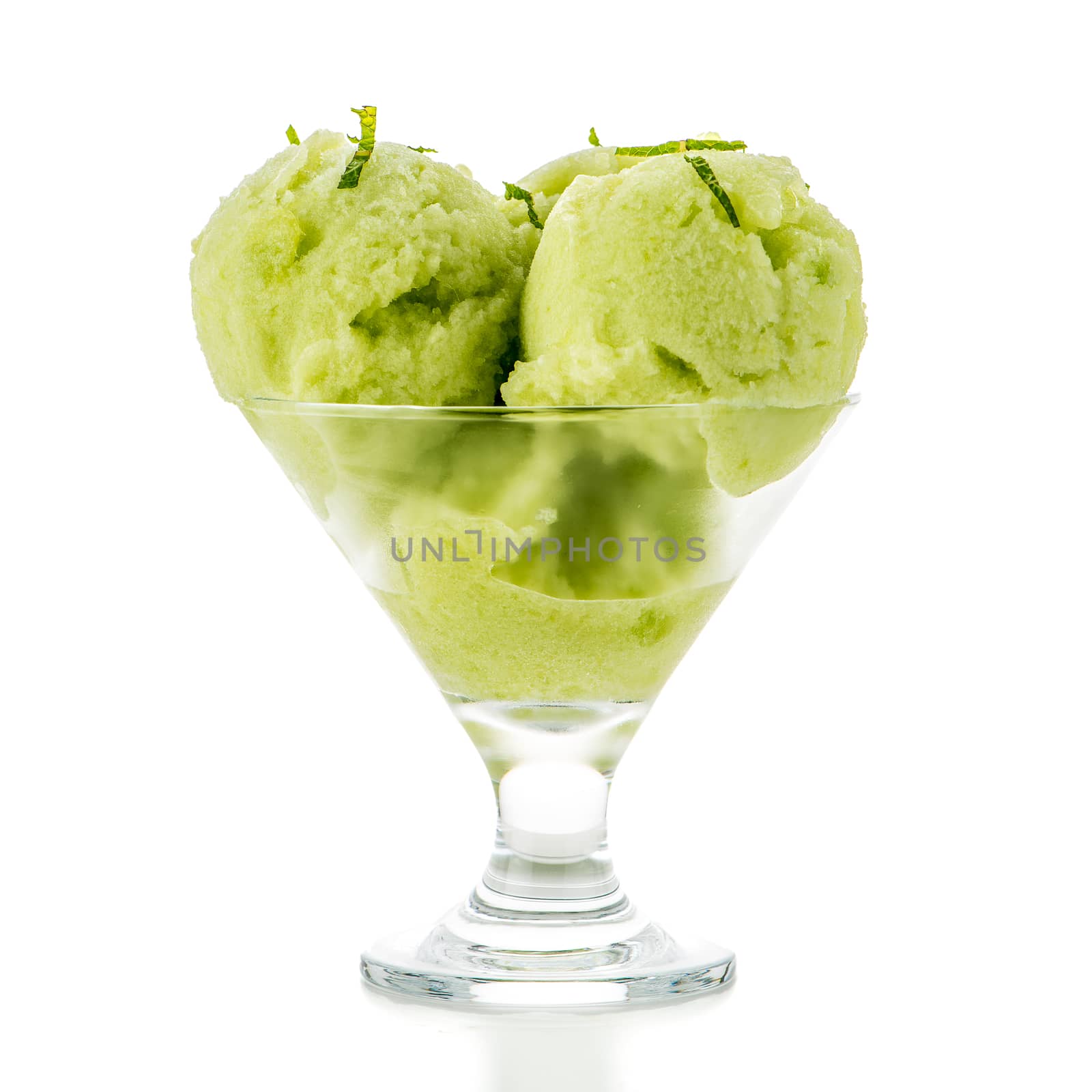 Close up of melon flavored ice-cream isolated on white background.