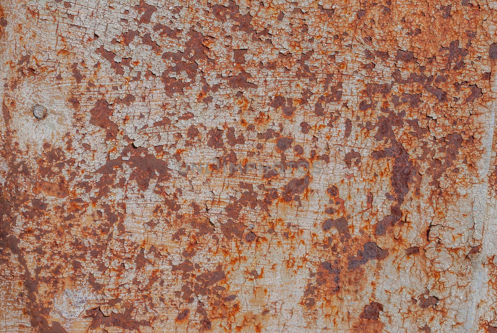 surface of rusty iron with remnants of old paint, chipped paint, texture background by uvisni