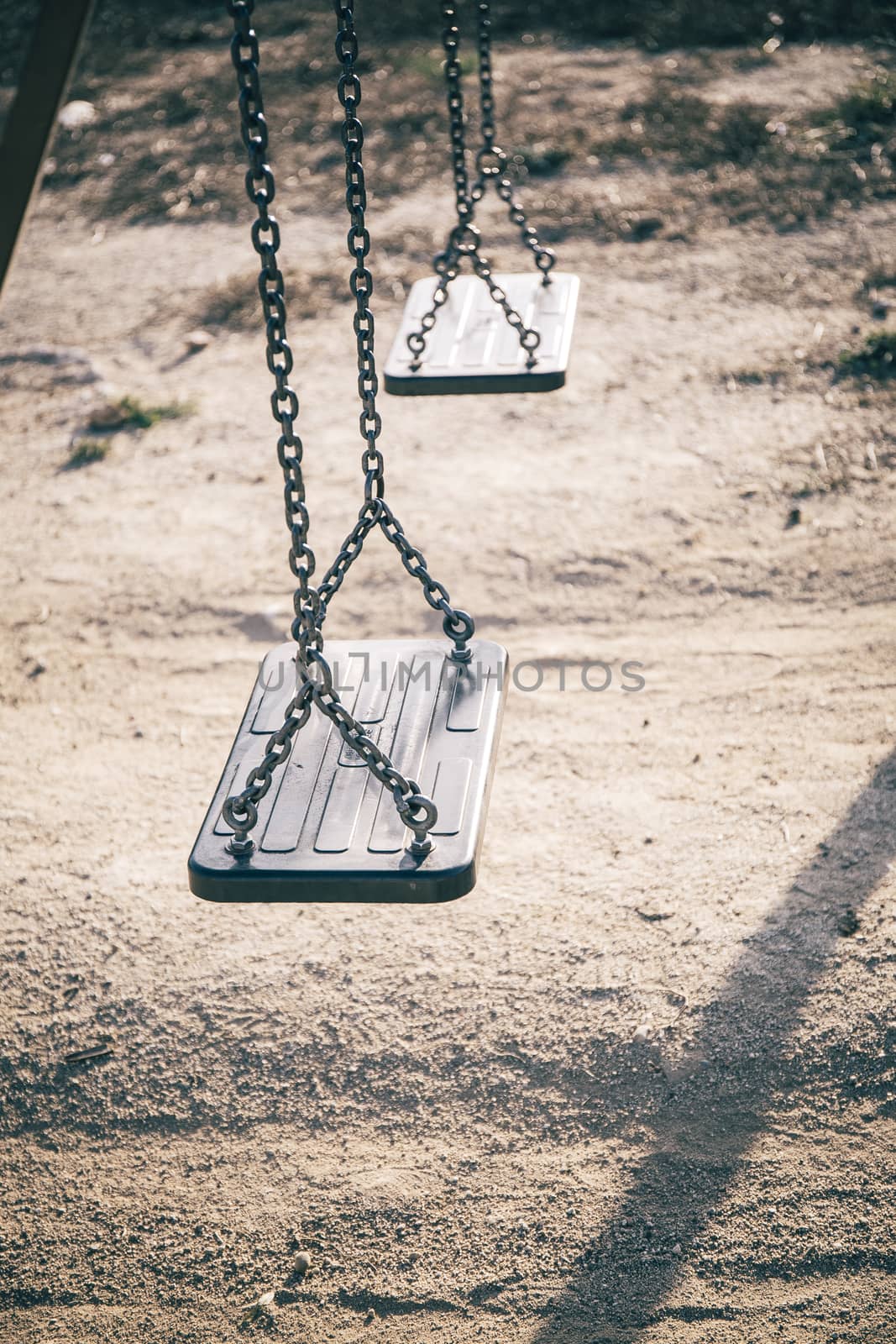 two black seats in the park by nachrc2001