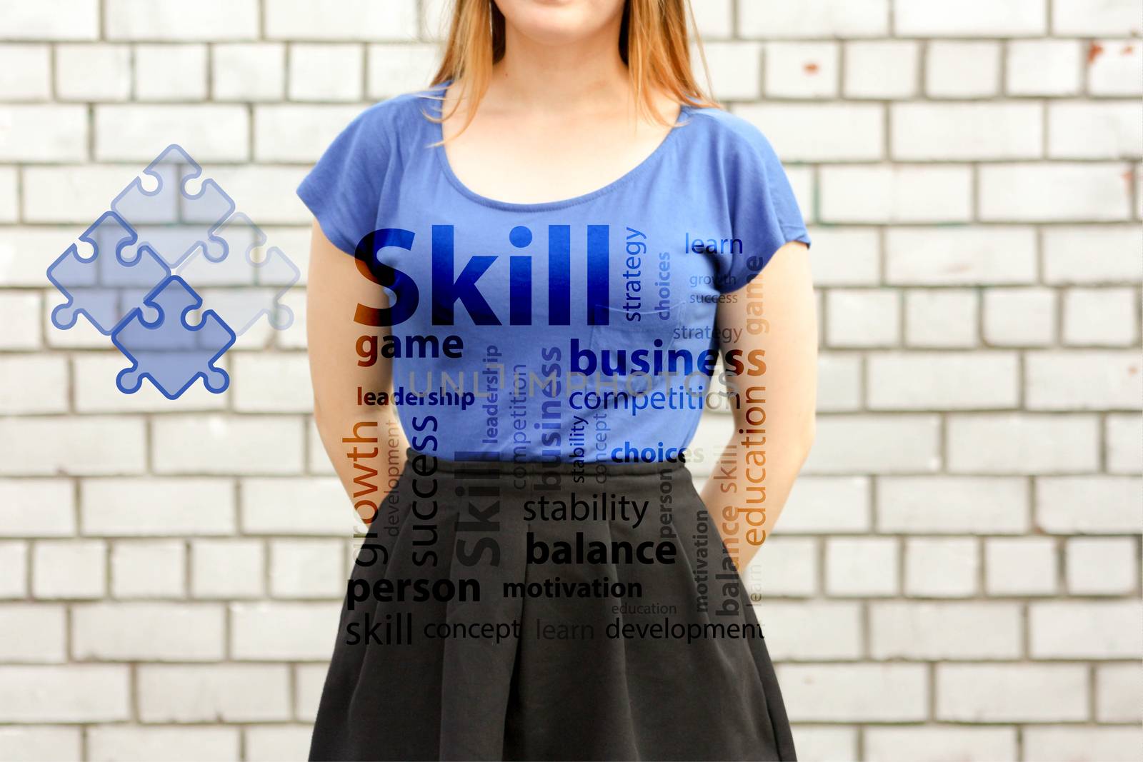 skill concept. photo for your design. girl in blue near a white brick wall