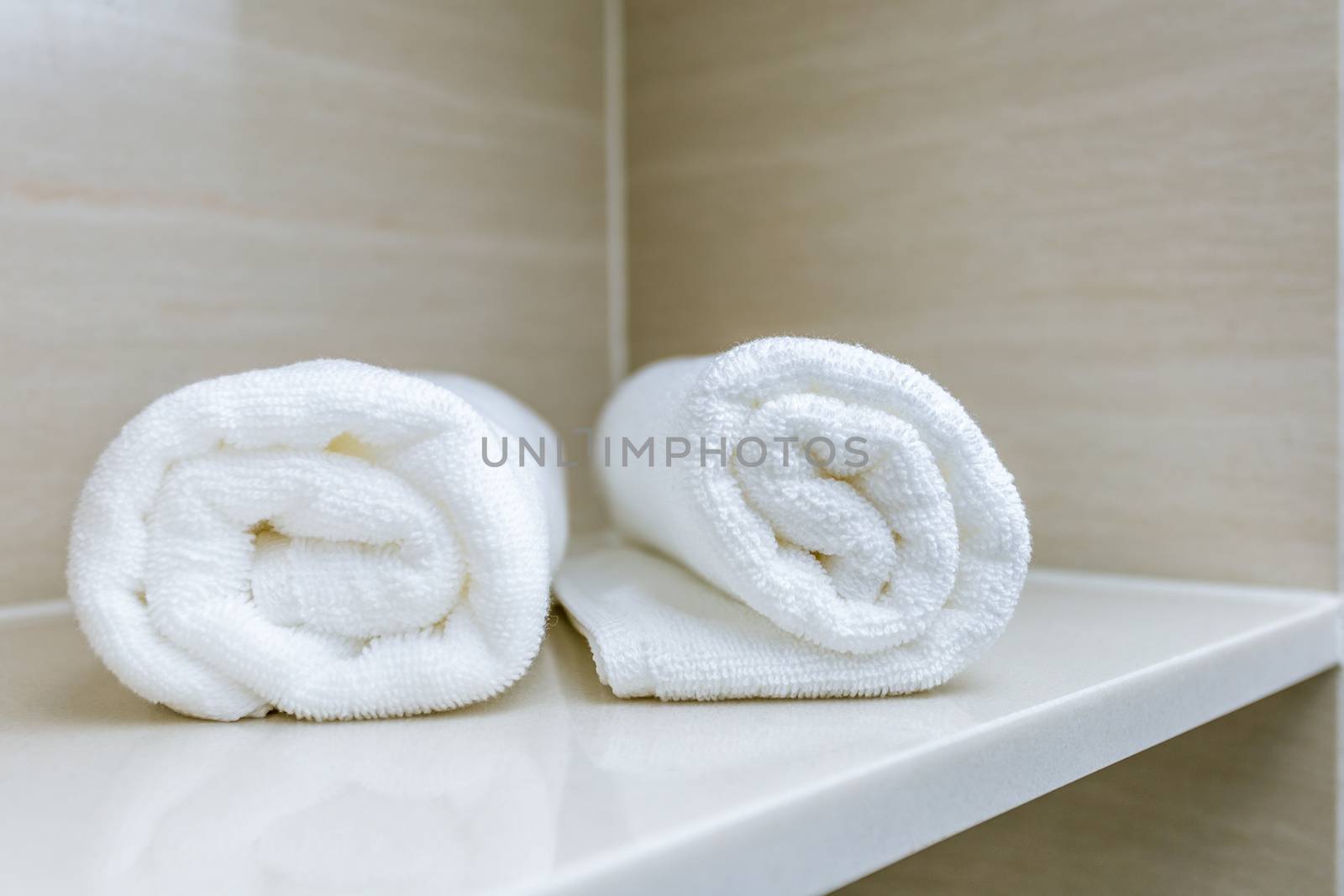 towel roll on bathroom shelf by antpkr