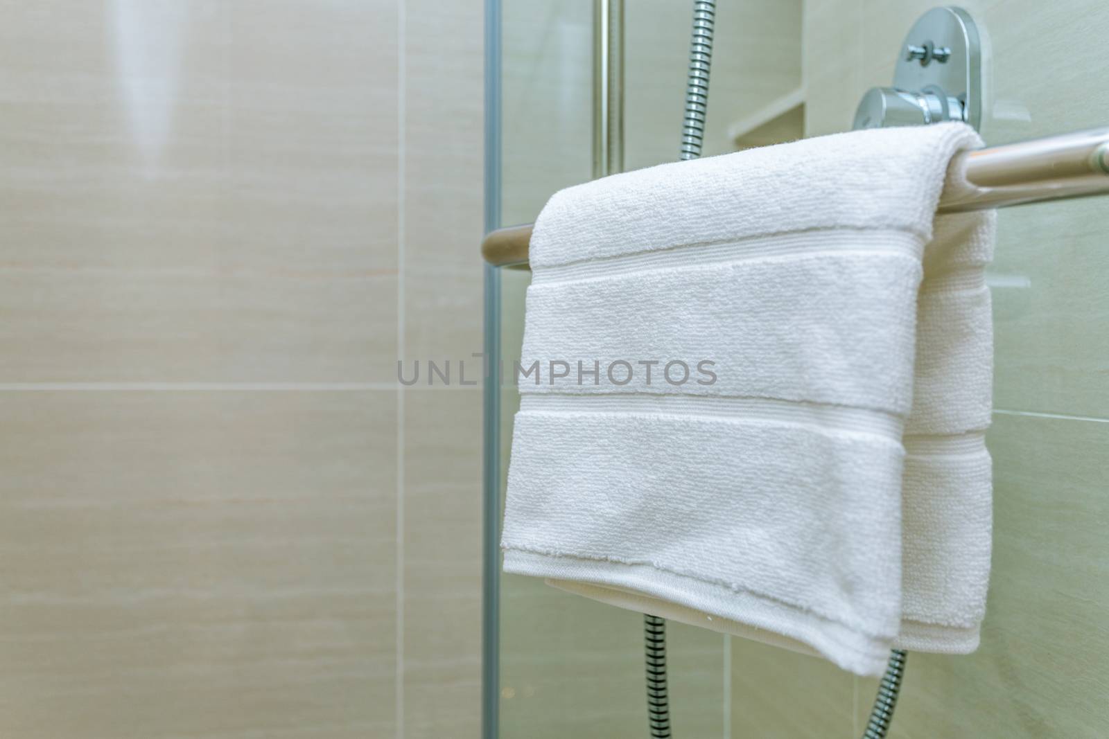 white towel on a hanger by antpkr