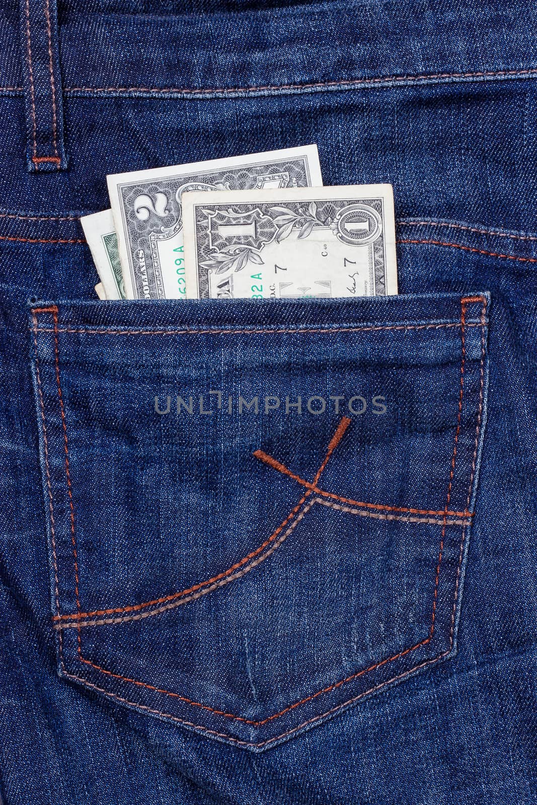 Some dollars in a pocket of jeans