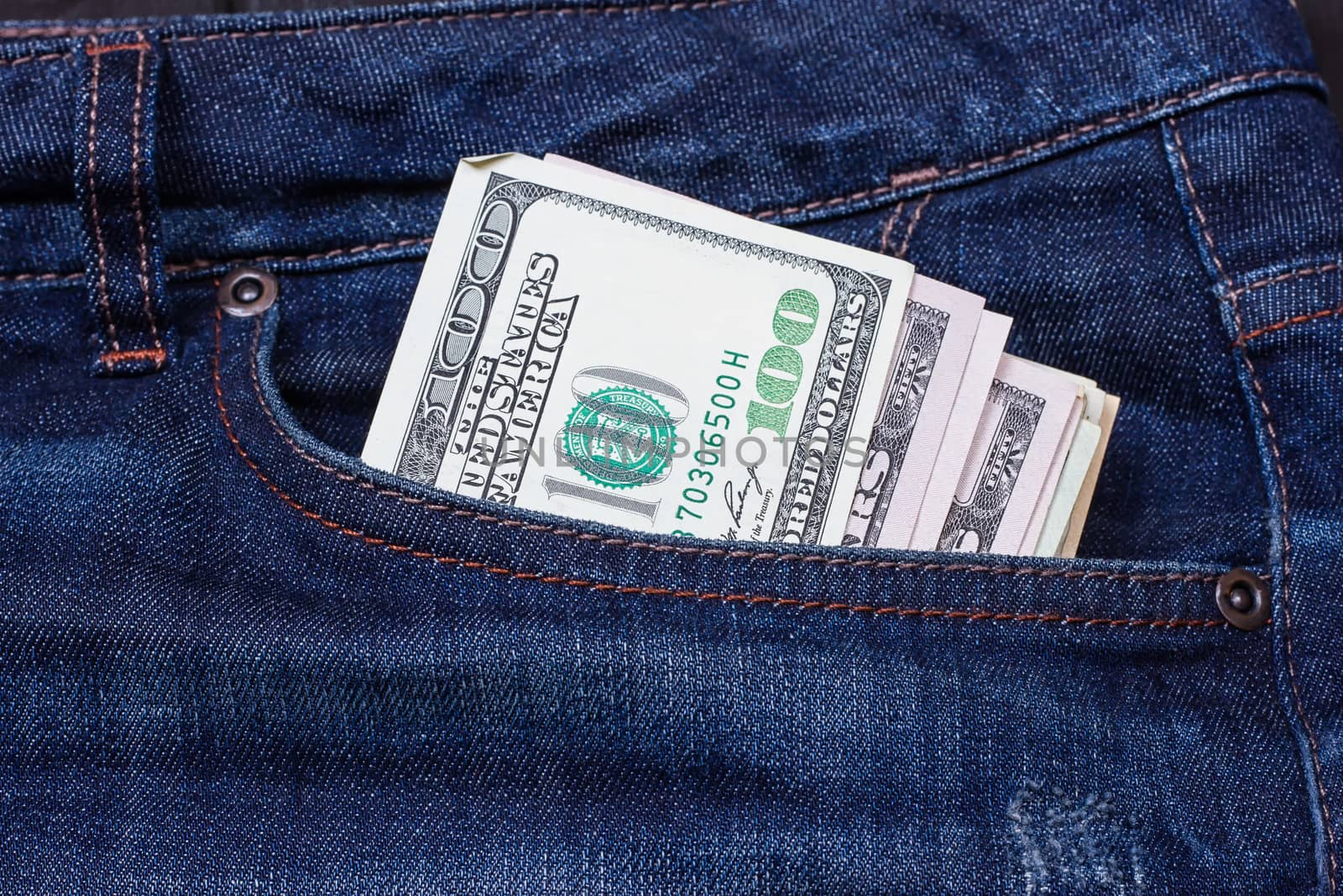 Some dollars in a pocket of jeans