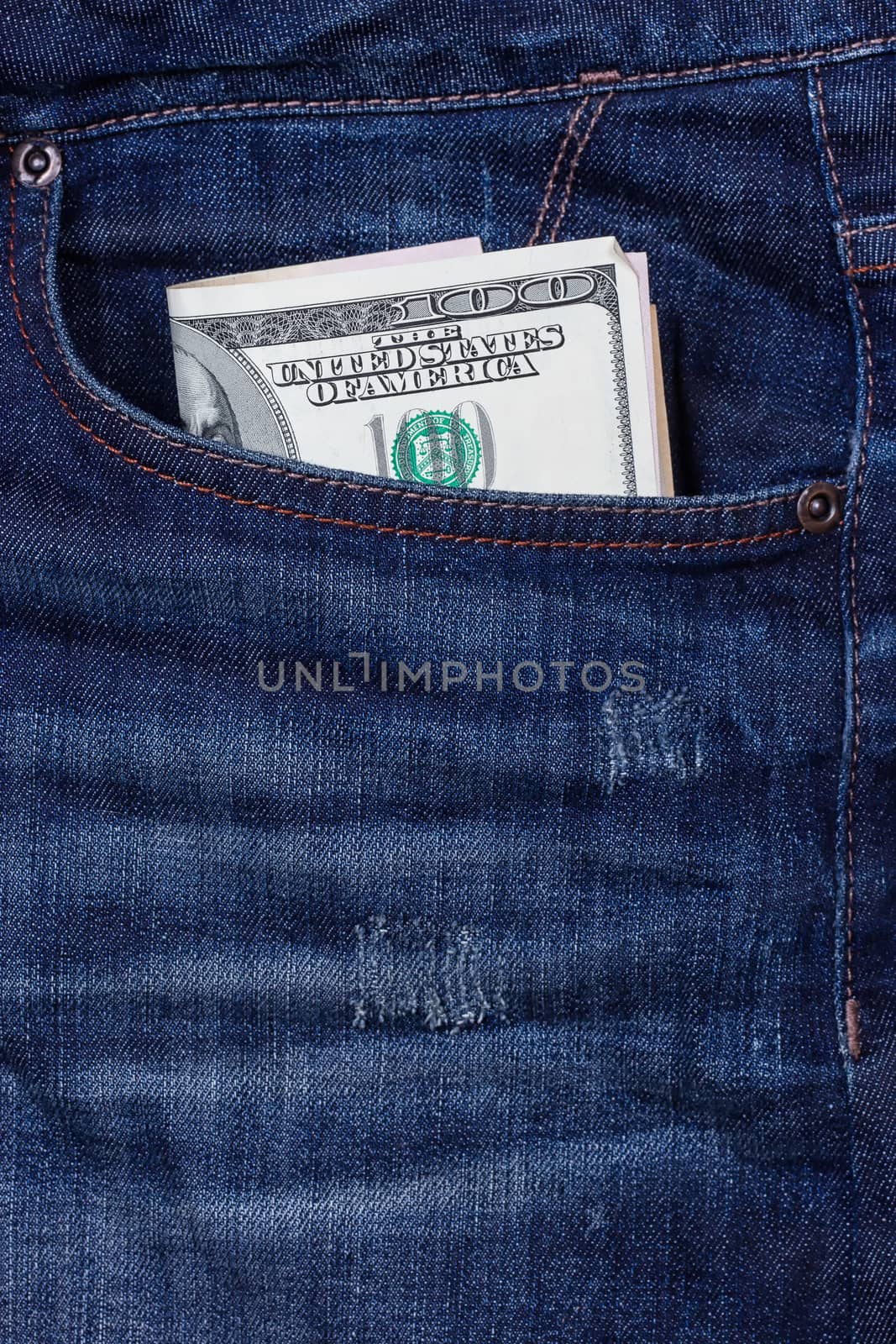 dollars in a pocket of jeans by victosha