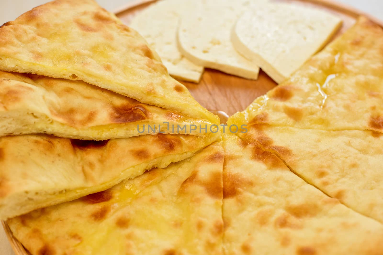ossetian pie with cheese on a white background