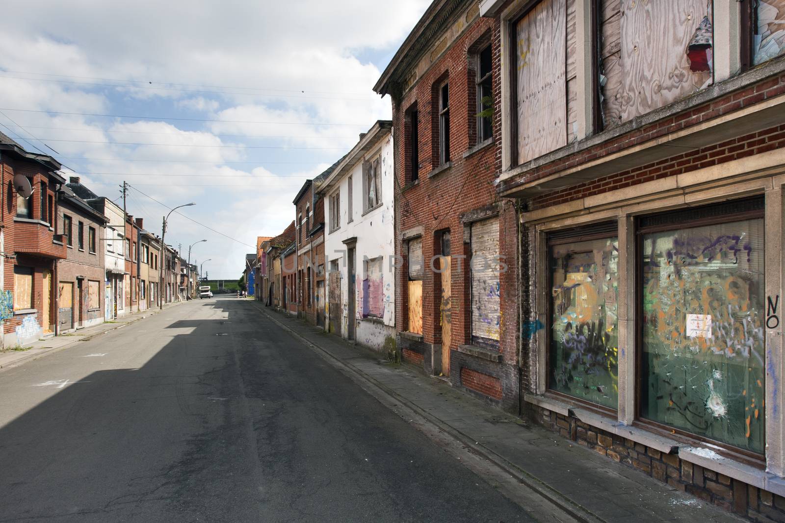 Street in ghost town Doel in Belgium