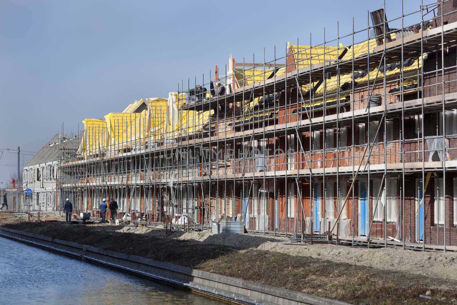 Residential construction site with some workers in Berkel in the Netherlands