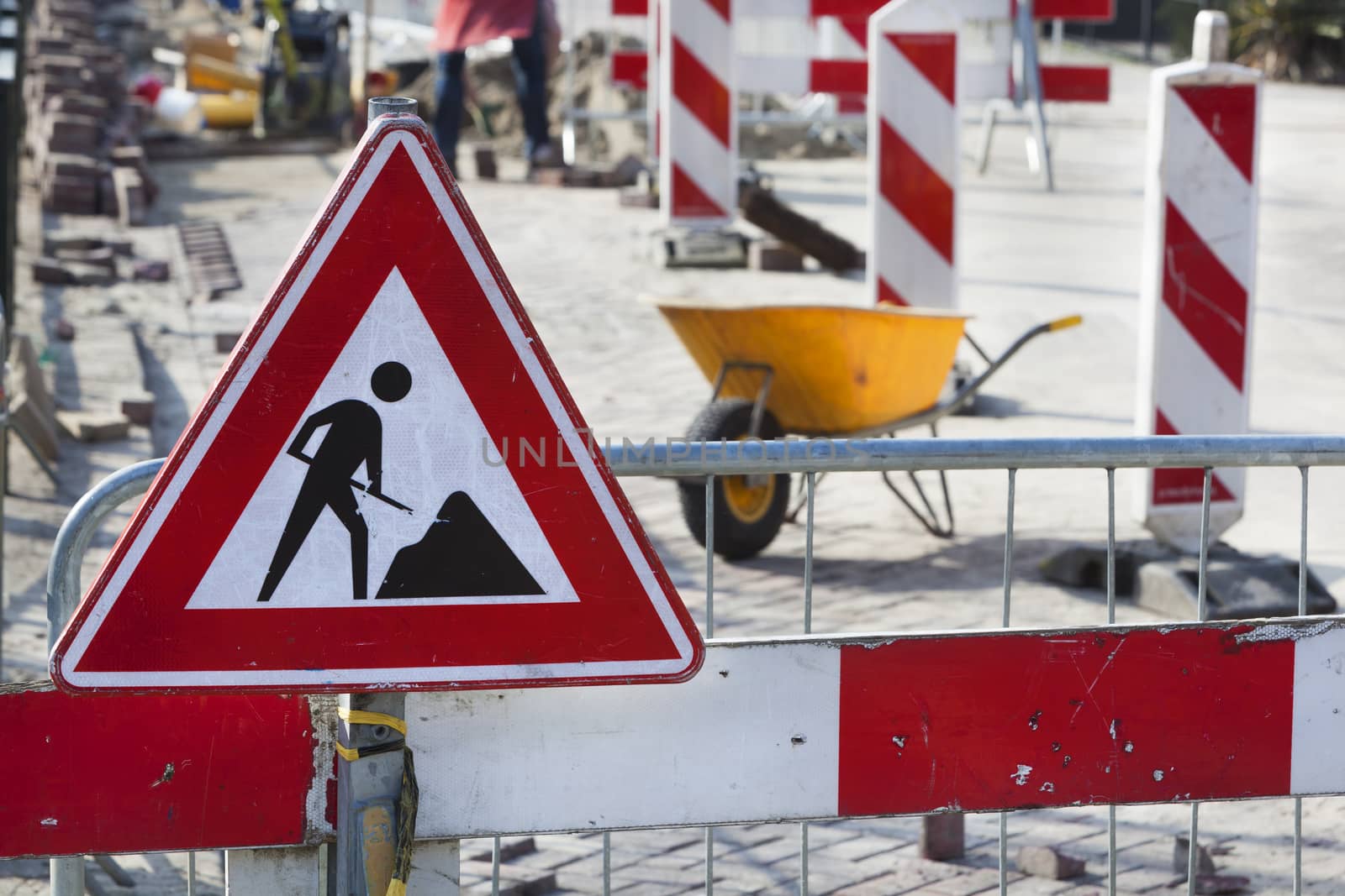 Road work and a work in progress sign