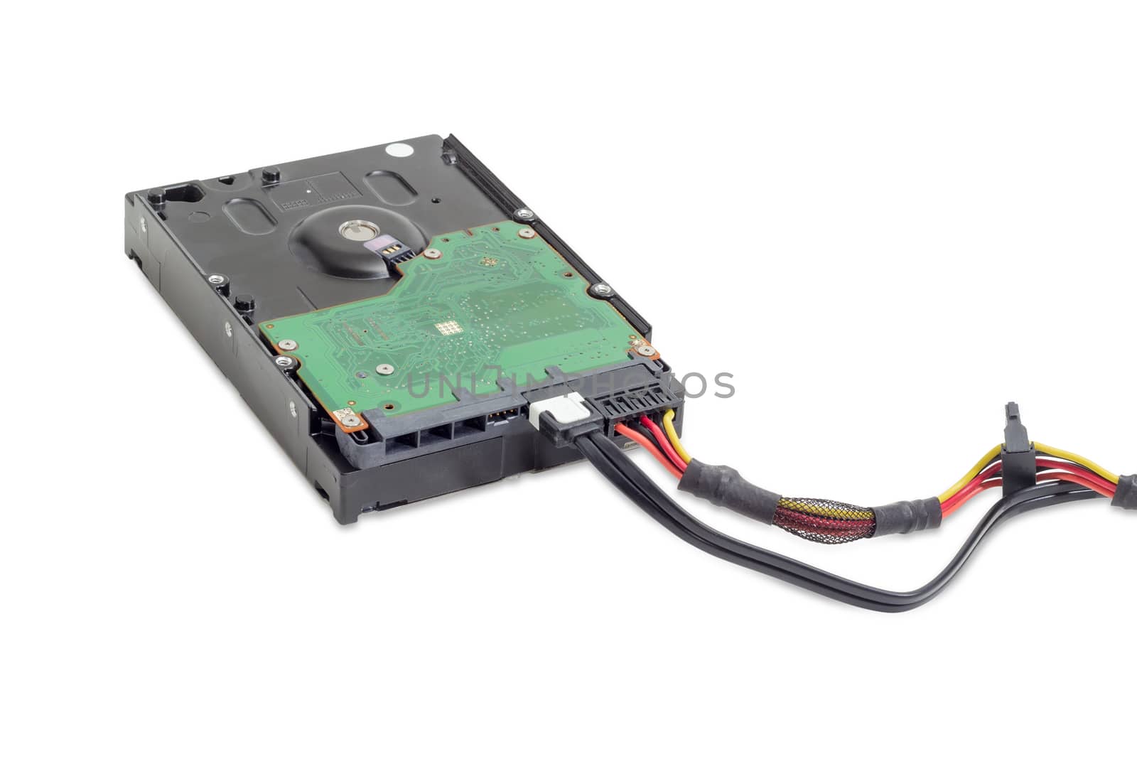 Hard disk drive for use in desktop computers with connected power cable and data cable on a white background
