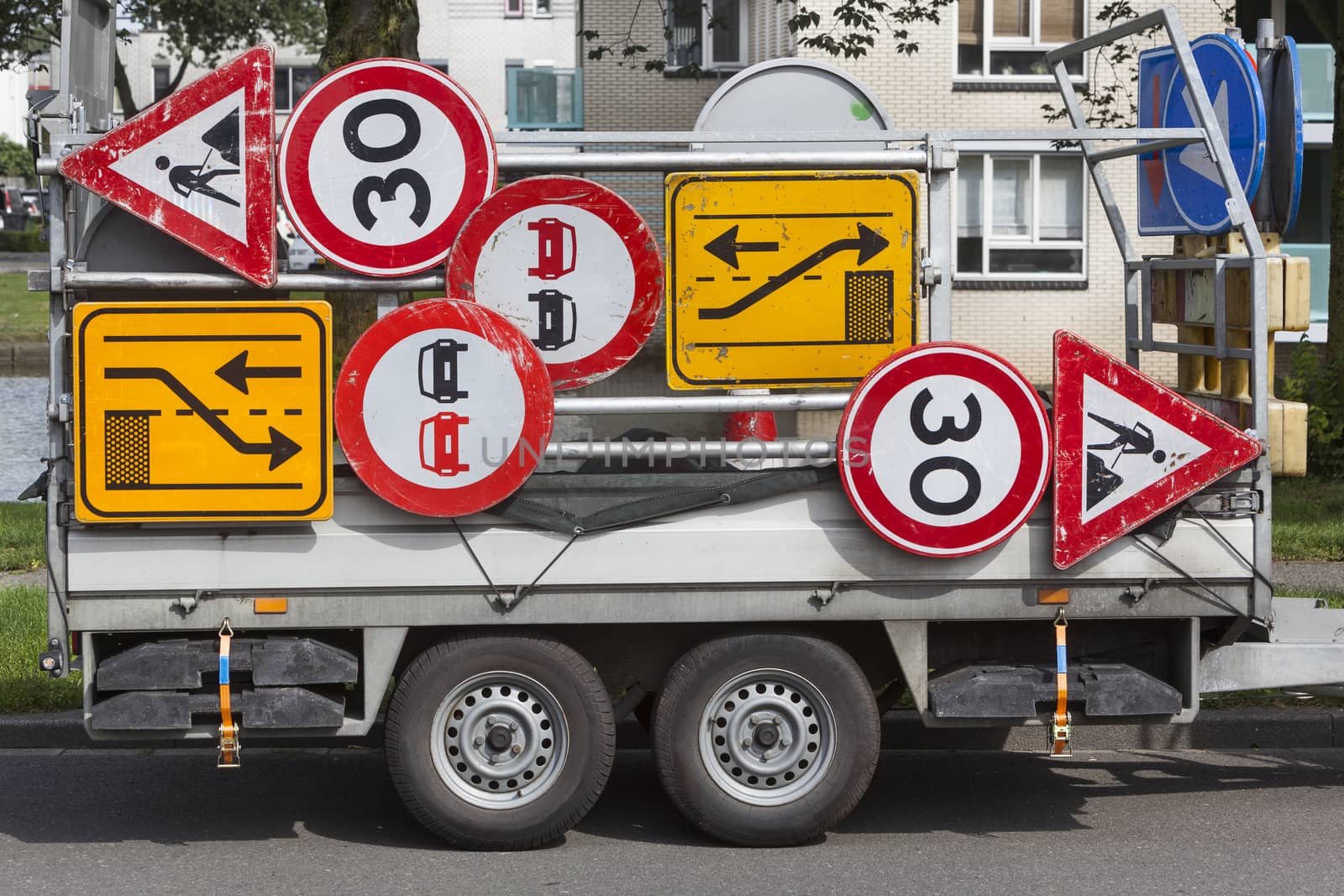 Confusing traffic signs on a trailer in the Netherlands