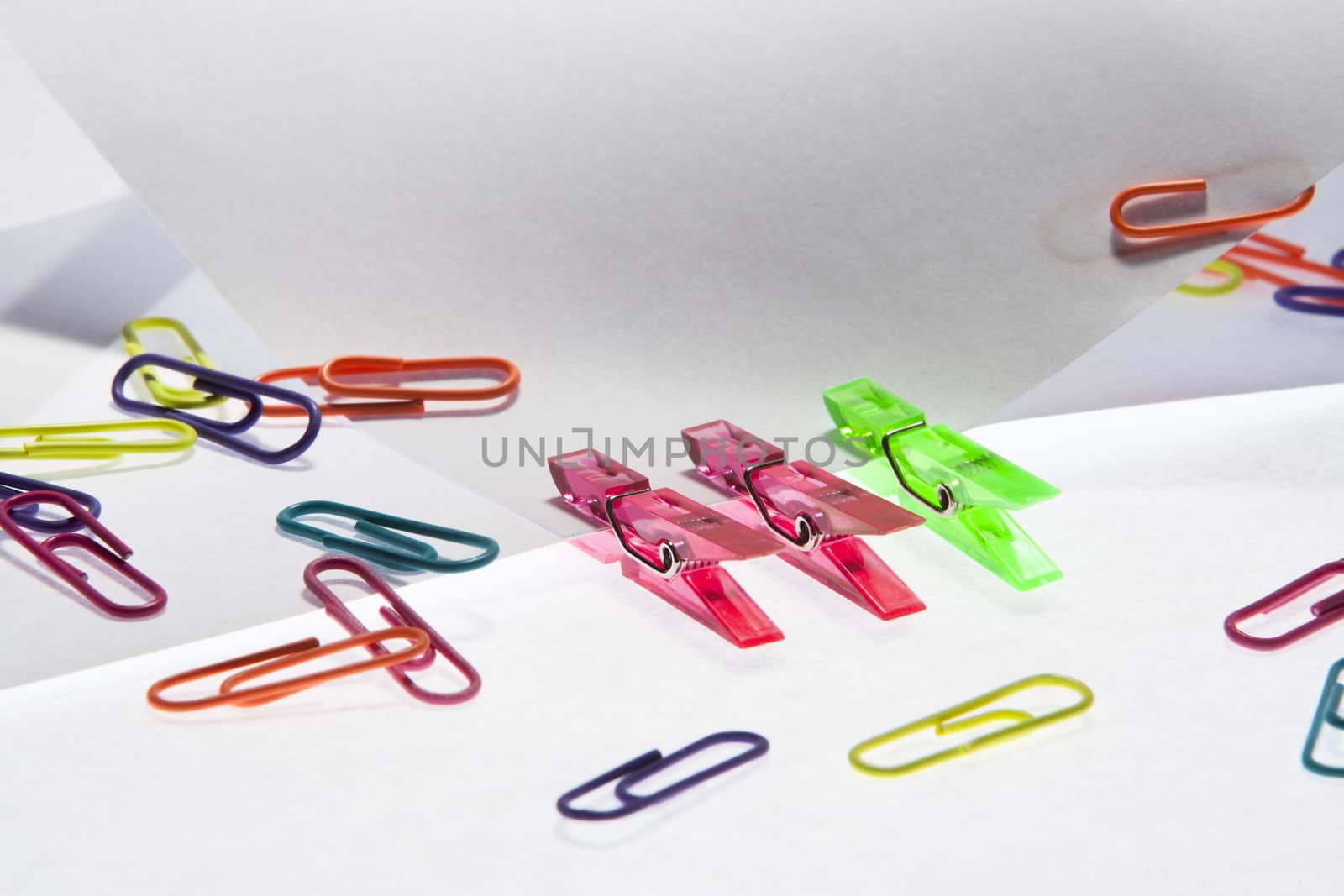 Colorful clips holding paper together 