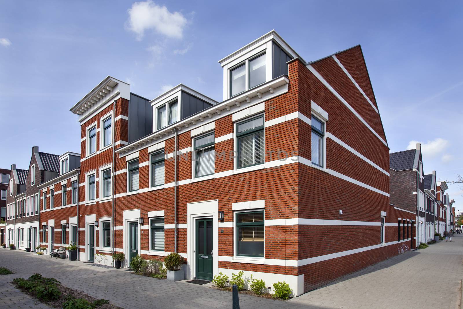 Street corner with new built classic style houses in Rotterdam in the Netherlands