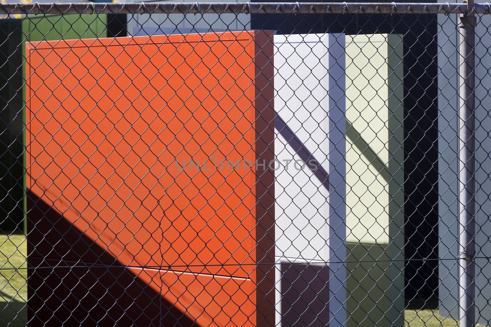 Colorful Industrial plates behind a fence in the Netherlands