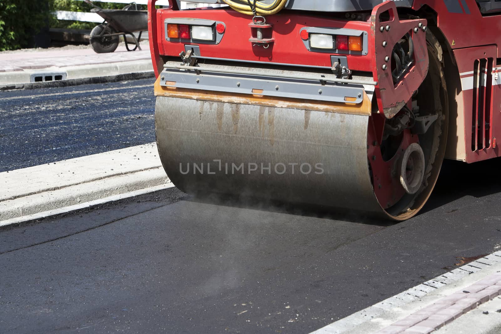 Steamroller in action on asphalt