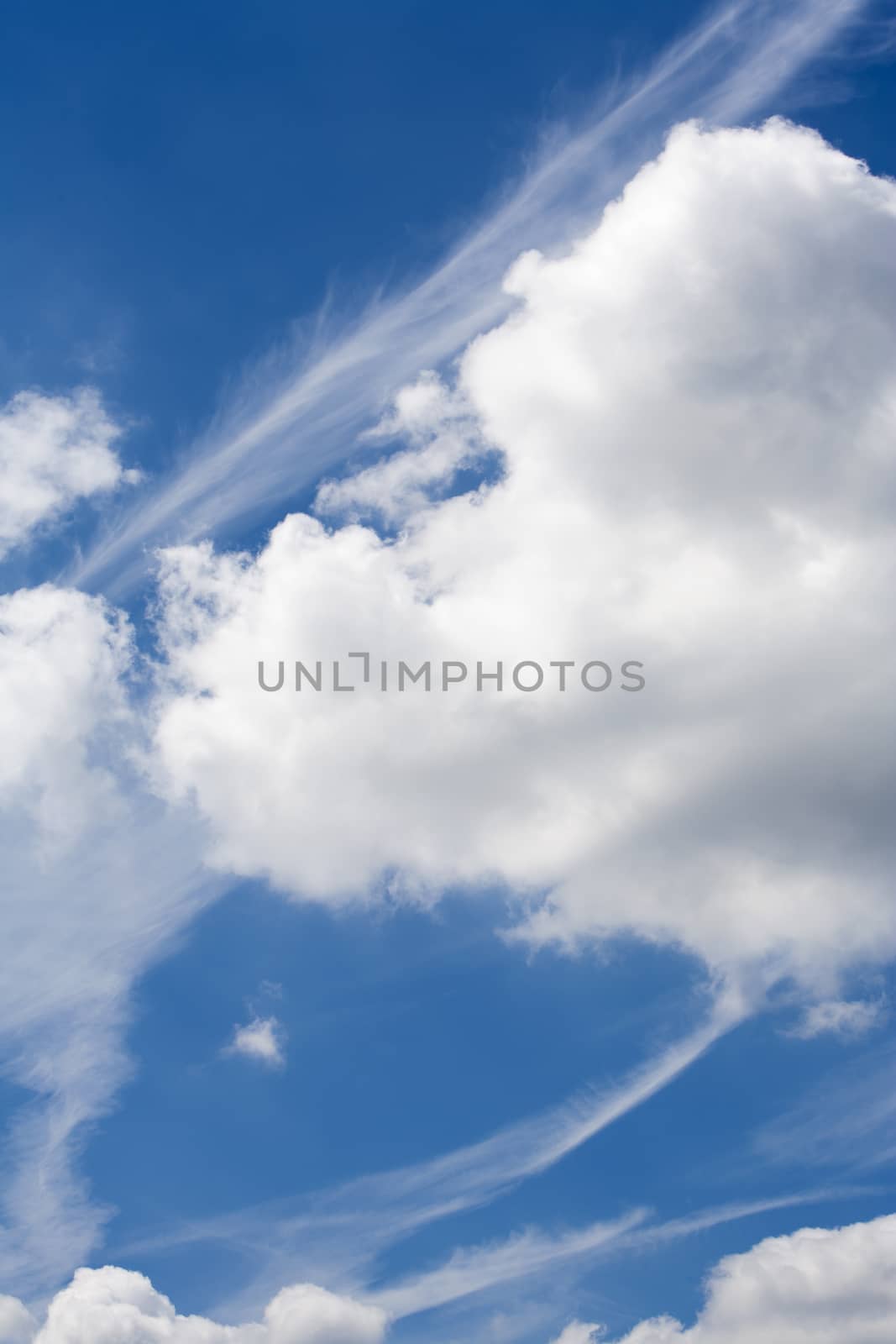 Blue sky with beautiful clouds and plane stripes