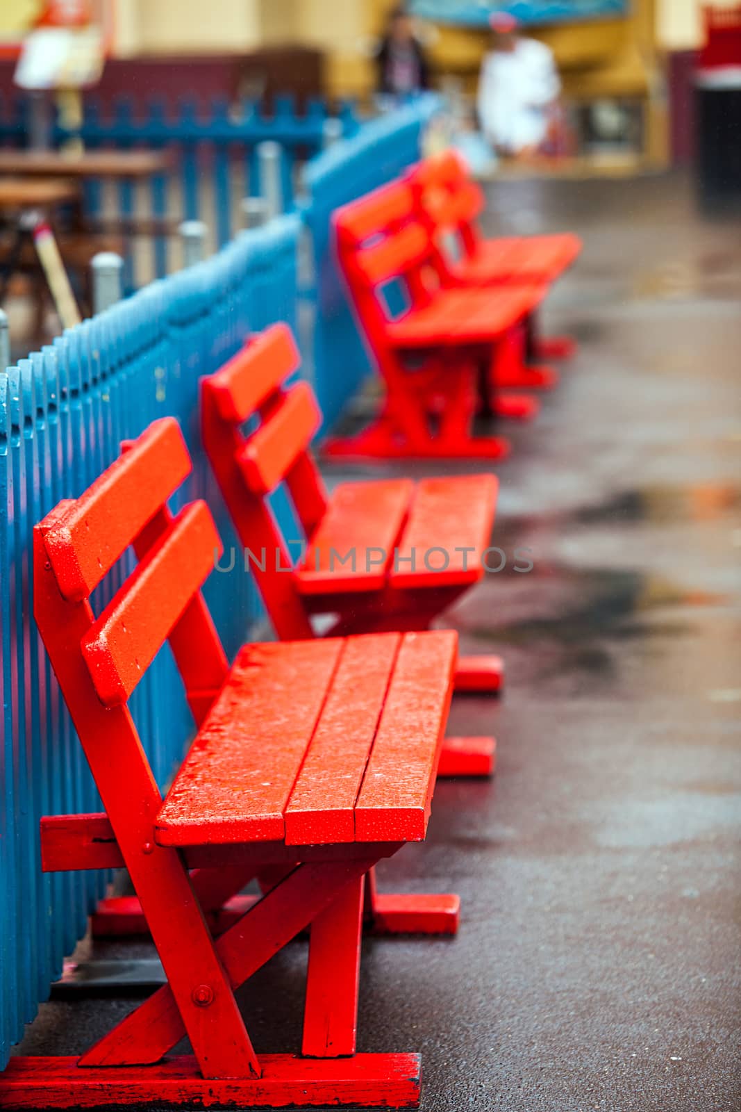 Colorful wooden benches at the Lunapark in Sydney Australia by Makeral